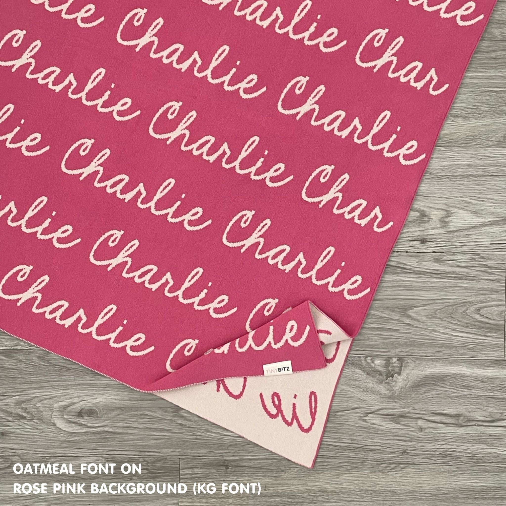 Personalised pet blanket in rose pink and oatmeal knitted cotton, custom dog blanket by TinyBitz, styled on modern wooden dog bed.