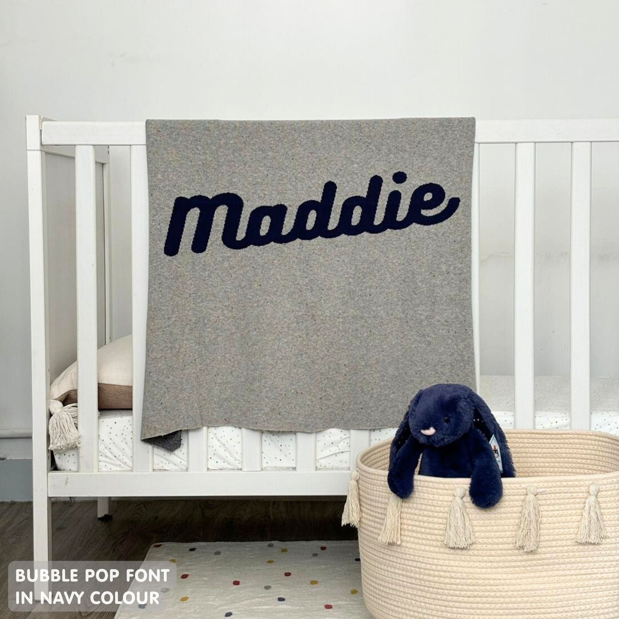 TinyBitz personalized baby name blanket, knitted in grey and navy with a confetti pattern, perfect baby shower gift!