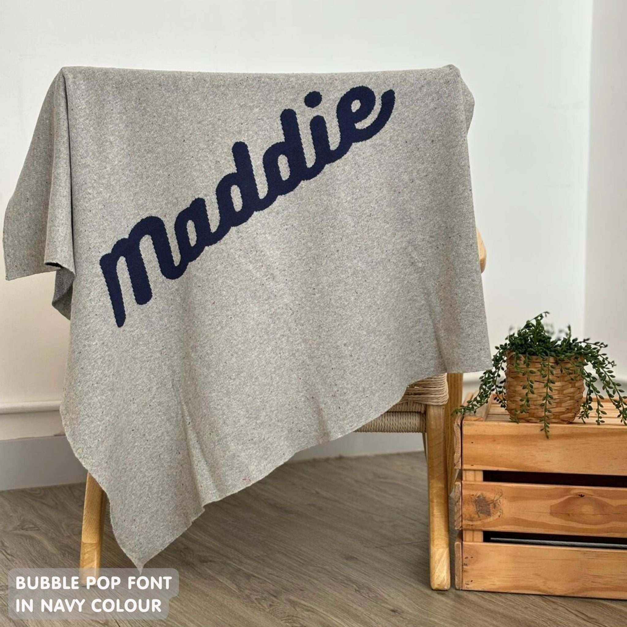 TinyBitz personalized name blanket in grey and navy with a confetti pattern, perfect gift for newborn babies and kids.