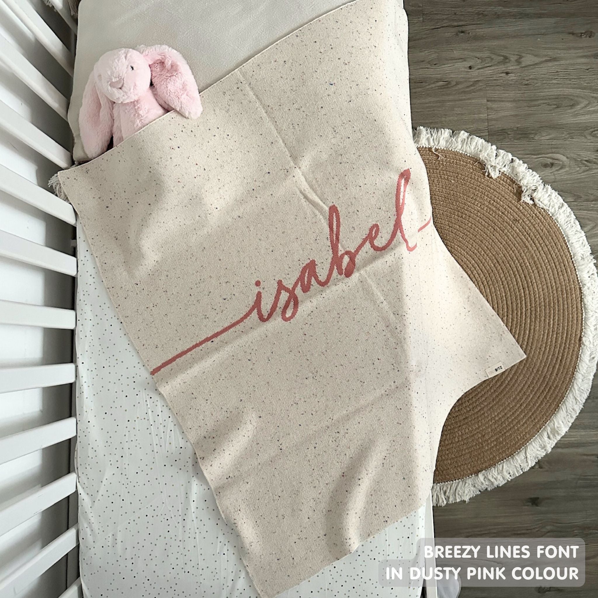 TinyBitz personalized name blanket in cream and dusty pink with a confetti pattern, perfect gift for newborn babies and kids.