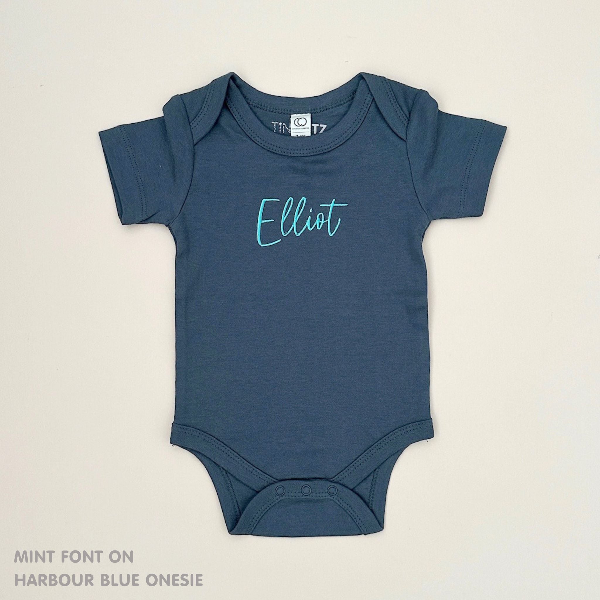 Organic cotton harbour blue onesie for babies with embroidered name, personalized baby shower gift keepsake from TinyBitz.