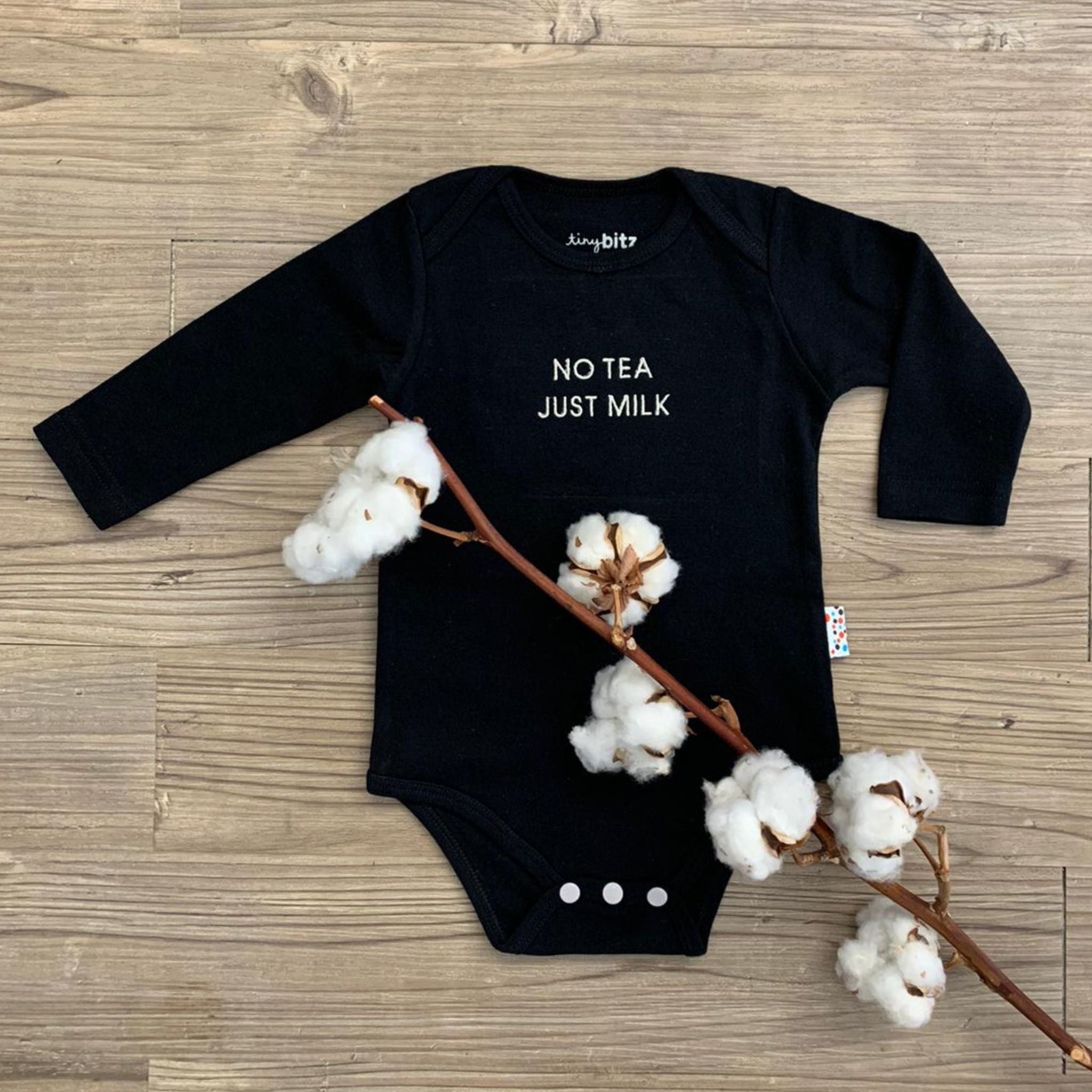 Organic cotton onesie for babies with quote “No Tea Just Milk” in white, personalized baby shower gift keepsake from TinyBitz.