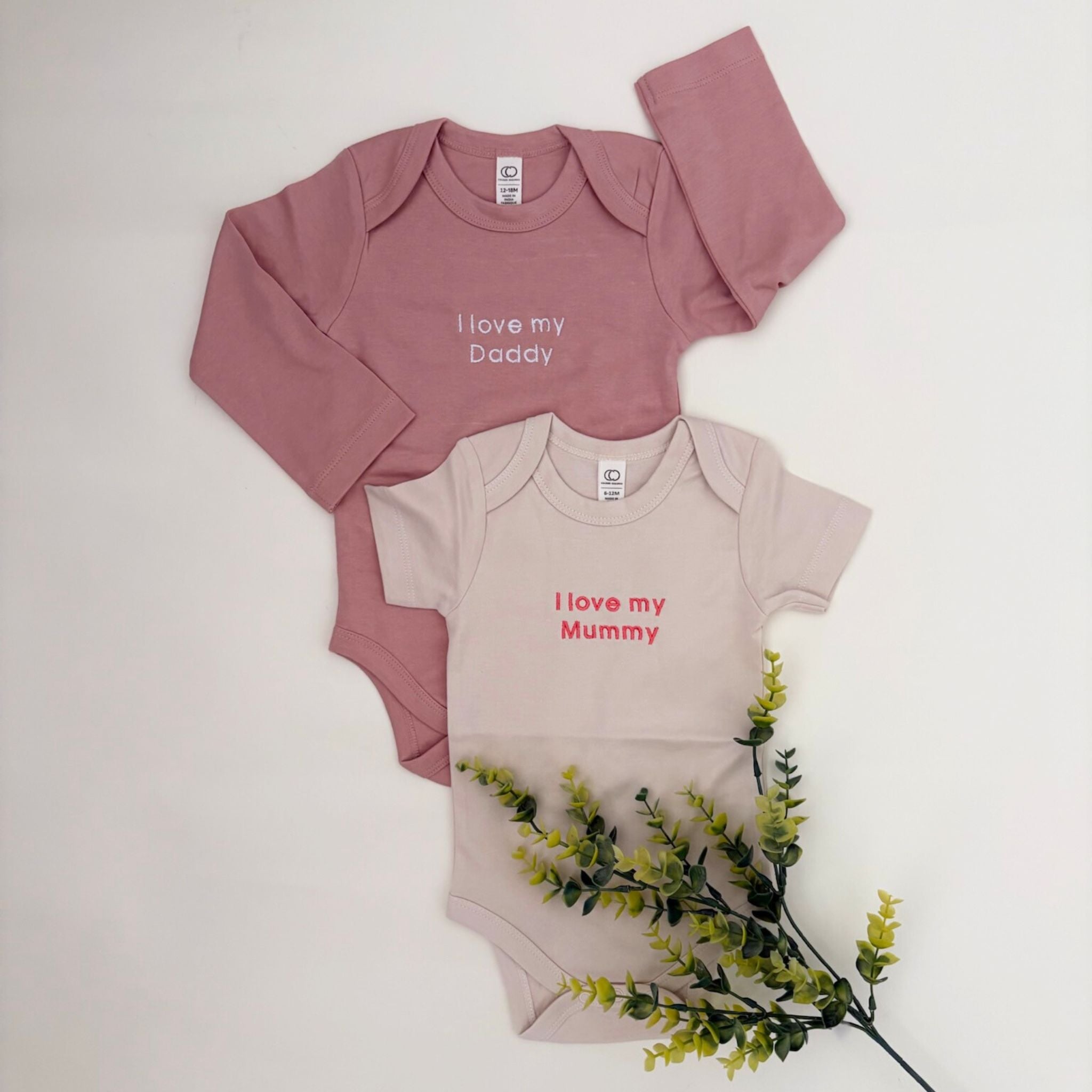 Organic cotton baby onesie with quote “I love my Daddy I love my Mummy”, ideal for baby shower gifts and keepsakes by TinyBitz.