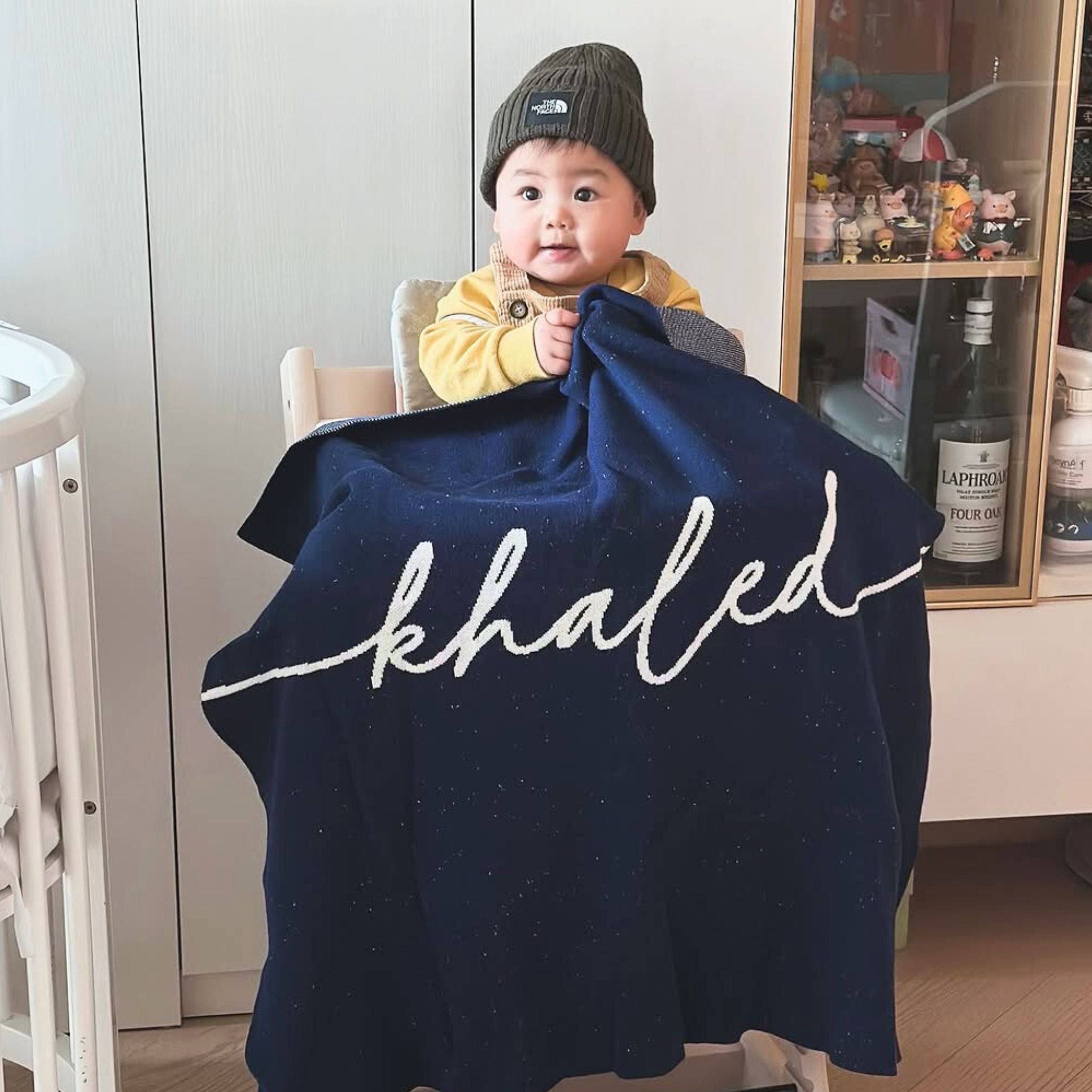 TinyBitz personalized name blanket in navy and white with a confetti pattern, perfect gift for newborn babies and kids.