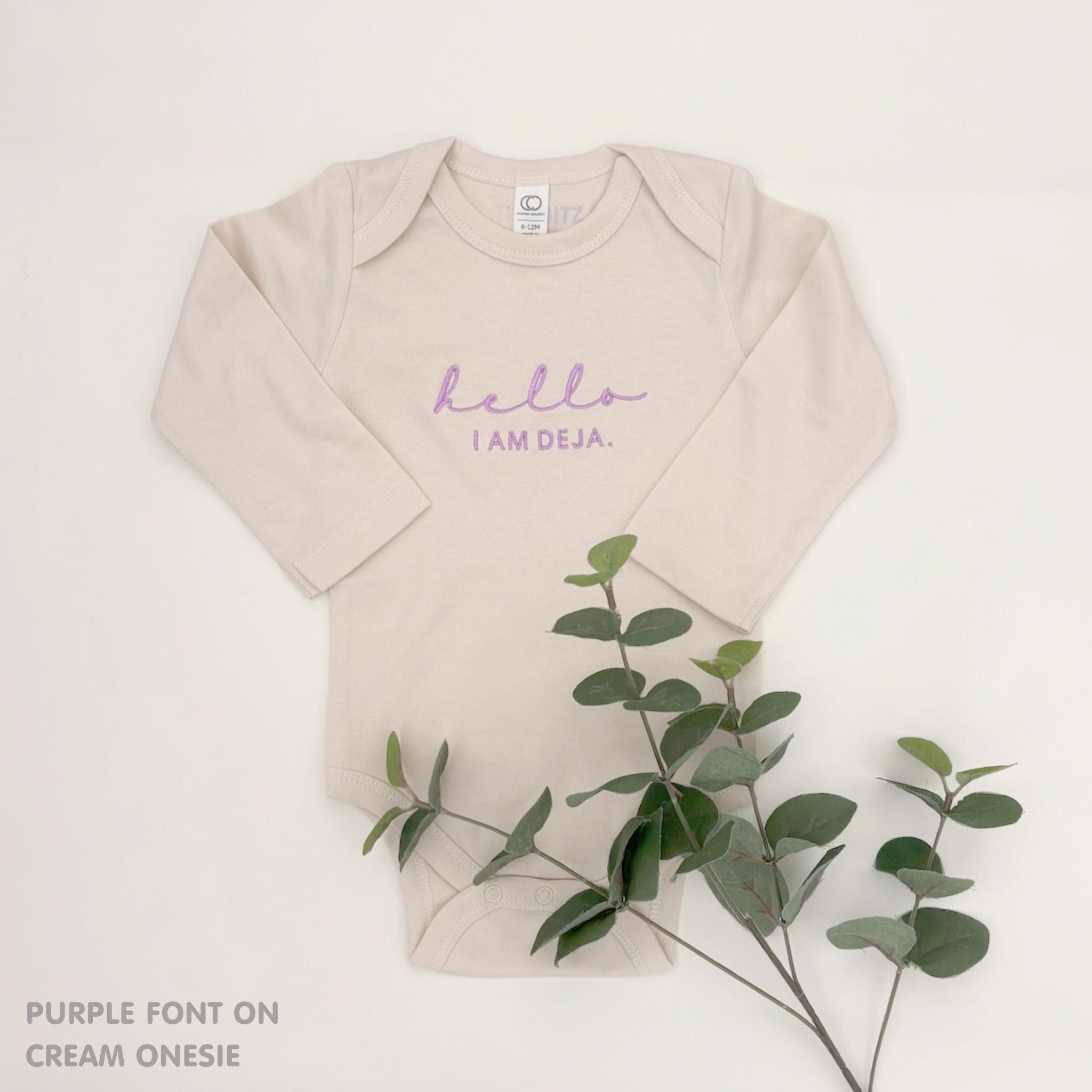 Custom name onesie in cream, personalised baby clothing made with soft breathable fabric by TinyBitz.