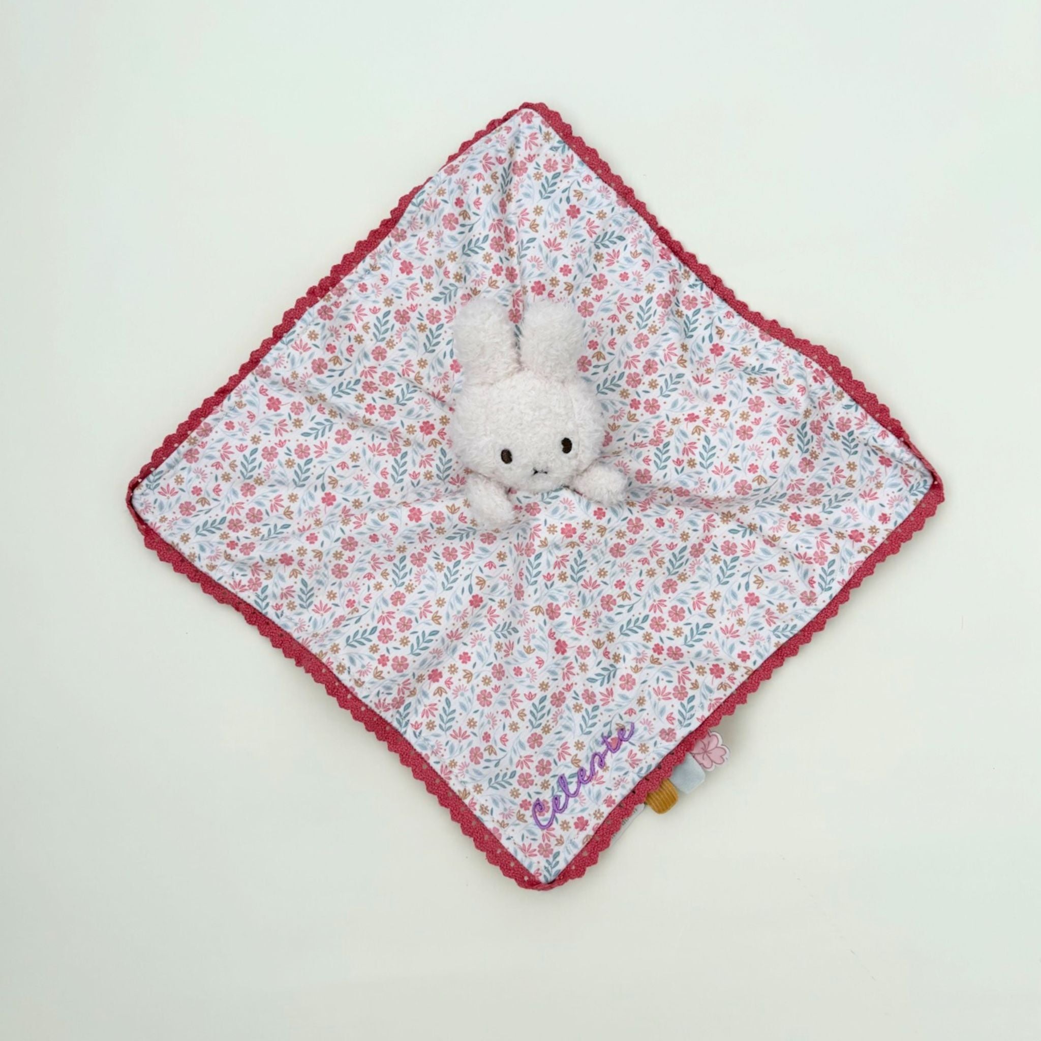 Floral Miffy cuddle cloth comforter embroidered with baby's name, a personalised baby gift and keepsake featuring the iconic Miffy toy.