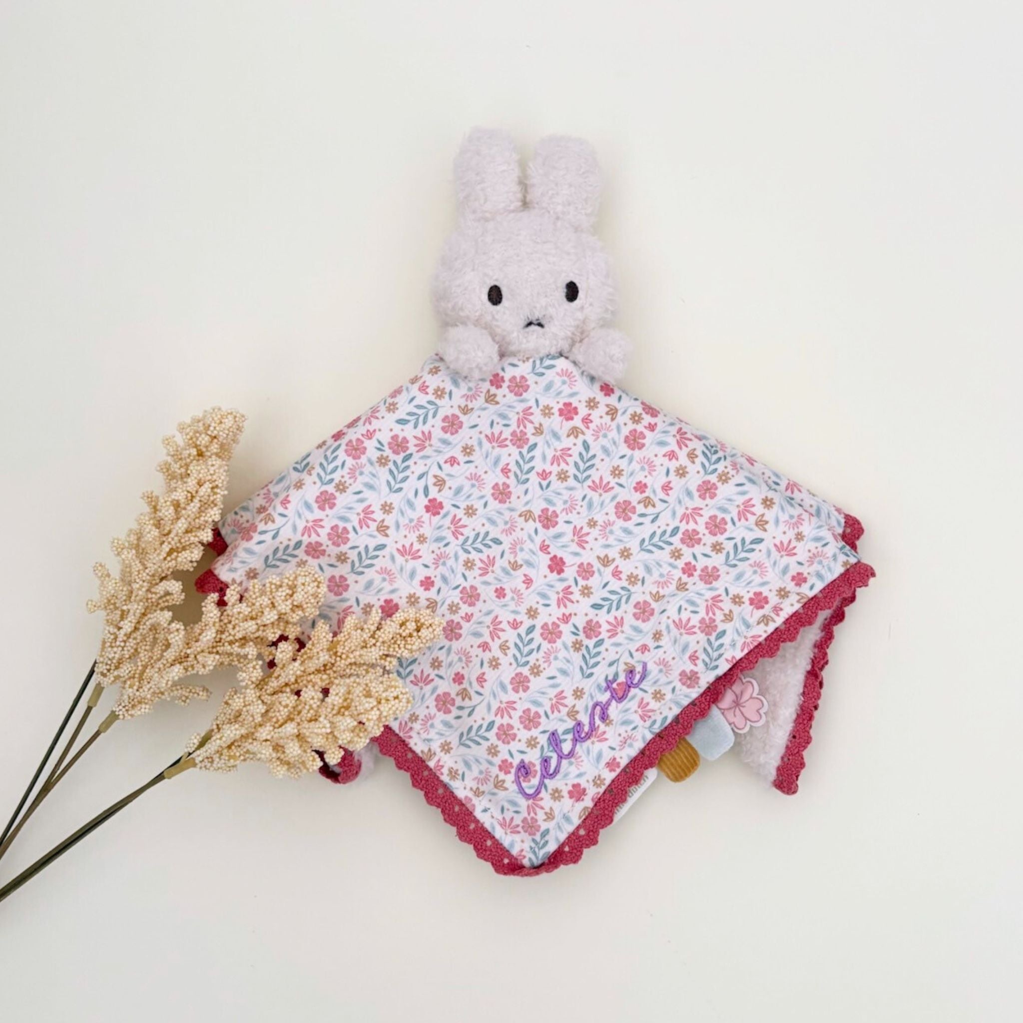 Floral Miffy cuddle cloth comforter embroidered with baby's name, a personalised baby gift and keepsake featuring the iconic Miffy toy.
