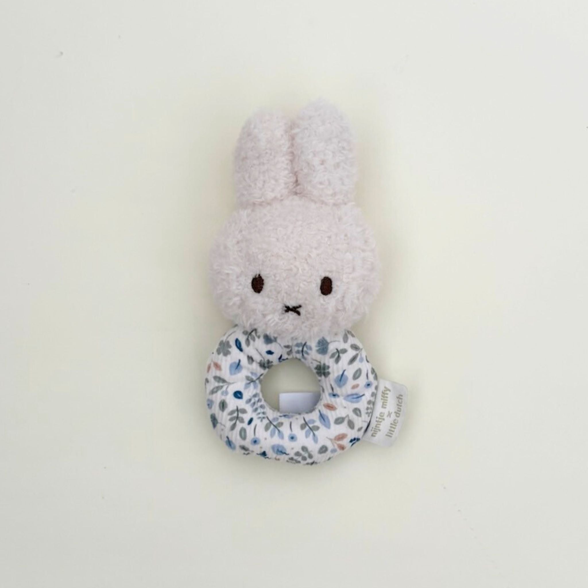 Floral Miffy plush toy with rattle in blue perfect for newborns, baby showers, and Miffy toy lovers.
