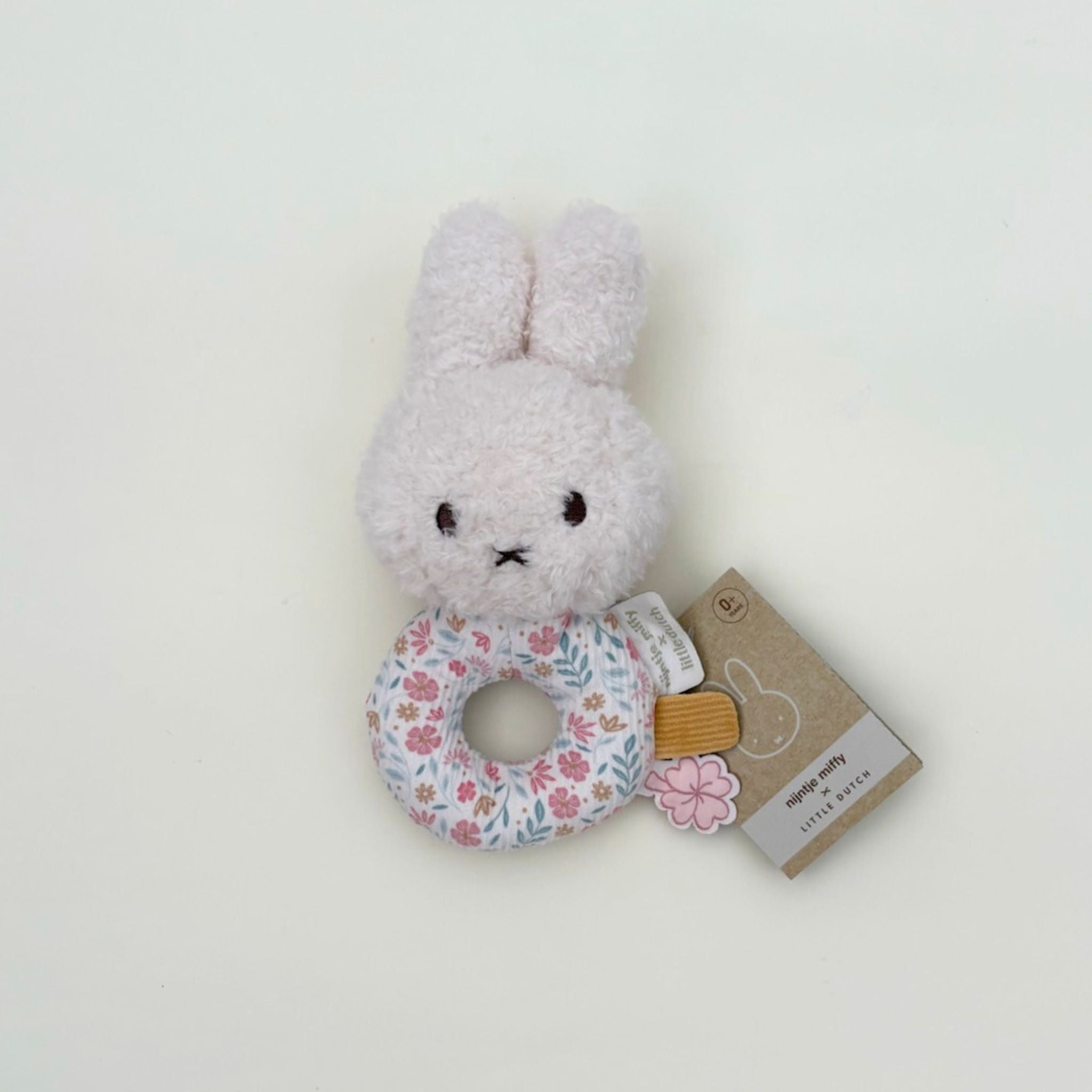 Floral Miffy plush toy with rattle in pink, perfect for newborns, baby showers, and Miffy toy lovers.