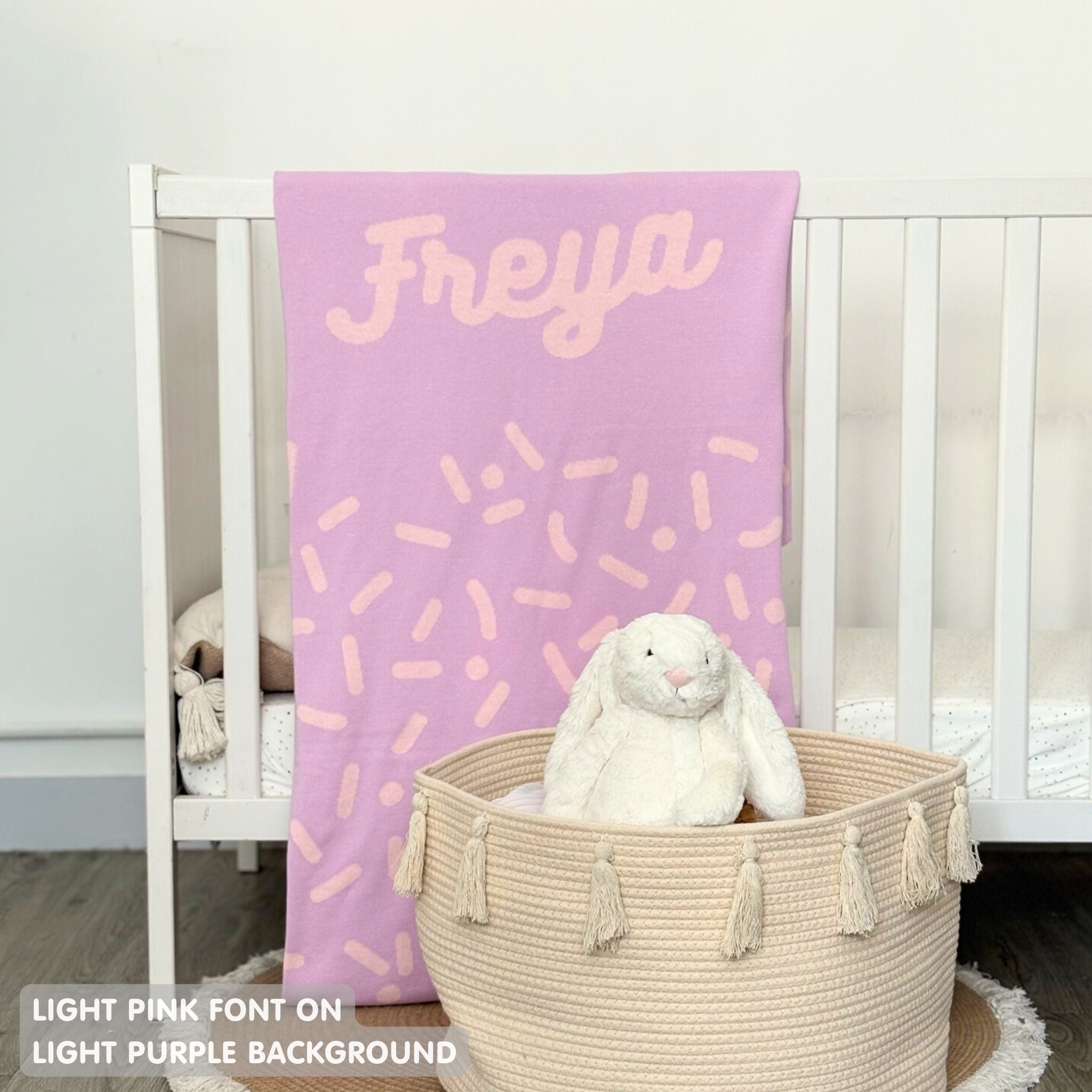 TinyBitz personalized name blanket in light purple and light pink with a confetti pattern, perfect gift for newborn babies and kids.