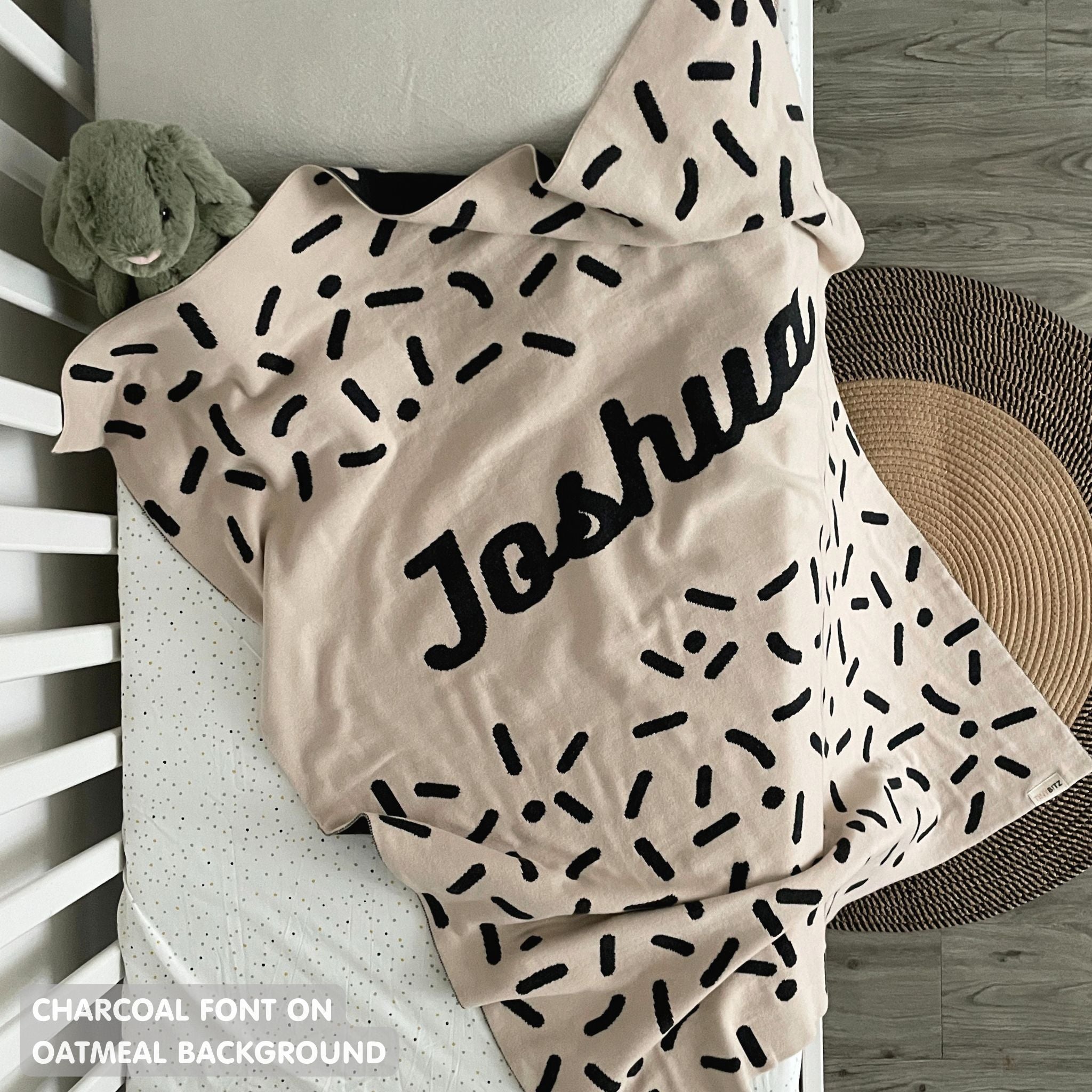 TinyBitz personalized baby name blanket, knitted in oatmeal and charcoal with a confetti pattern, perfect baby shower gift!