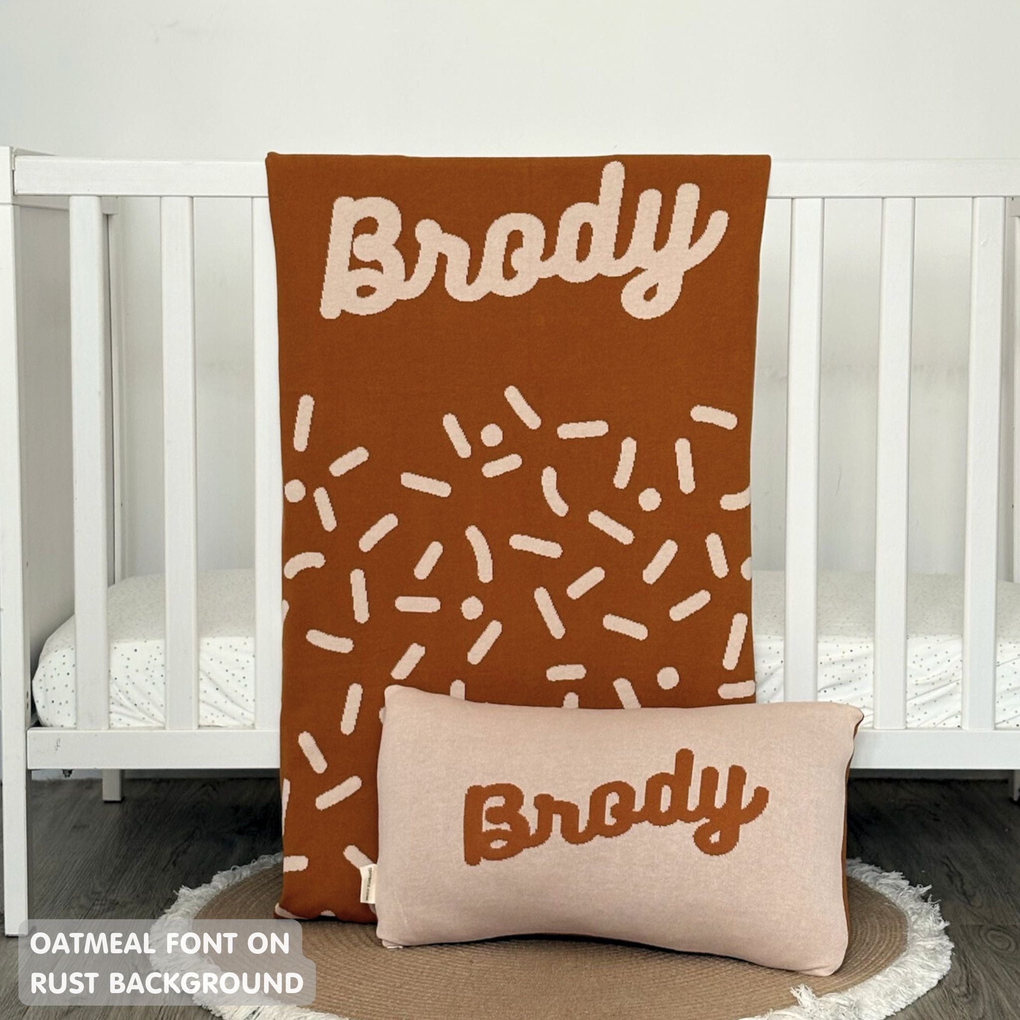 TinyBitz knitted name blanket in rust and oatmeal with a confetti pattern, a lovely touch to decorate your baby's room!