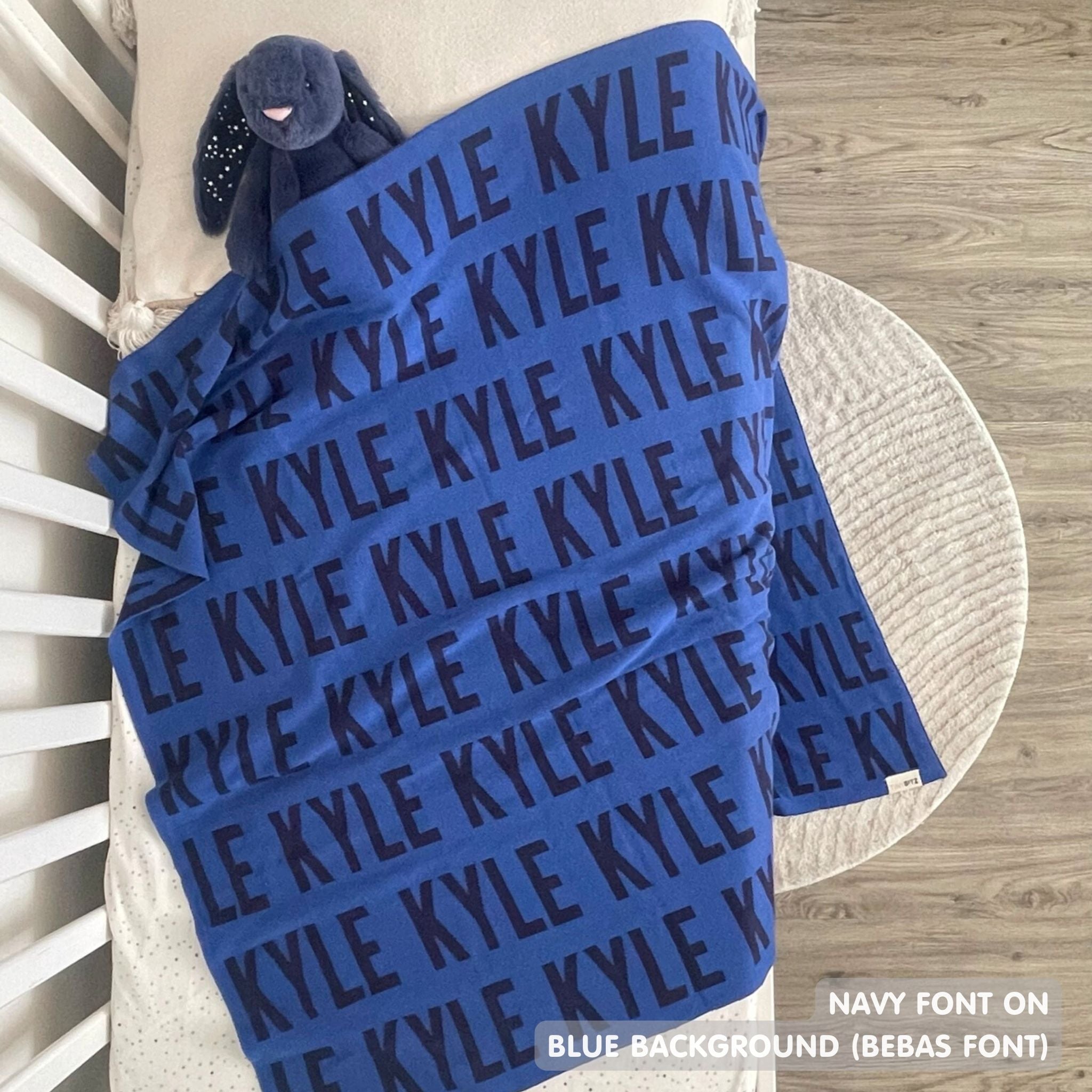 TinyBitz Personalized blanket for baby boys knitted from cotton in blue and navy.
