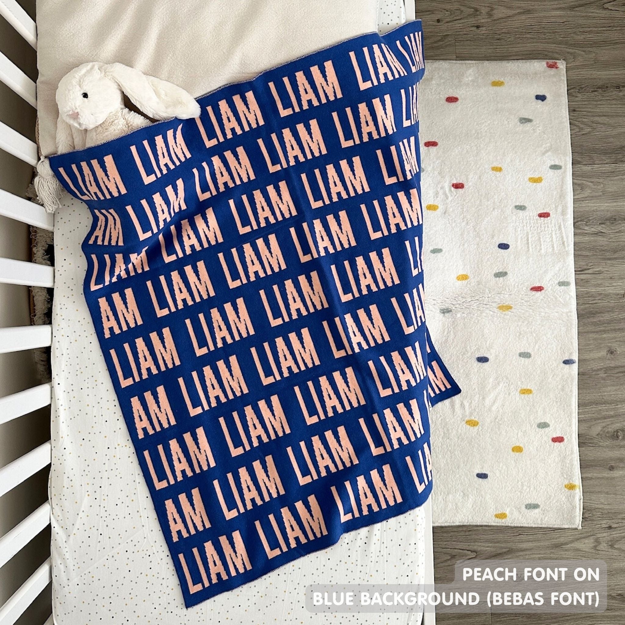 TinyBitz knitted name blanket in blue and peach can be used to decorate your baby's room!