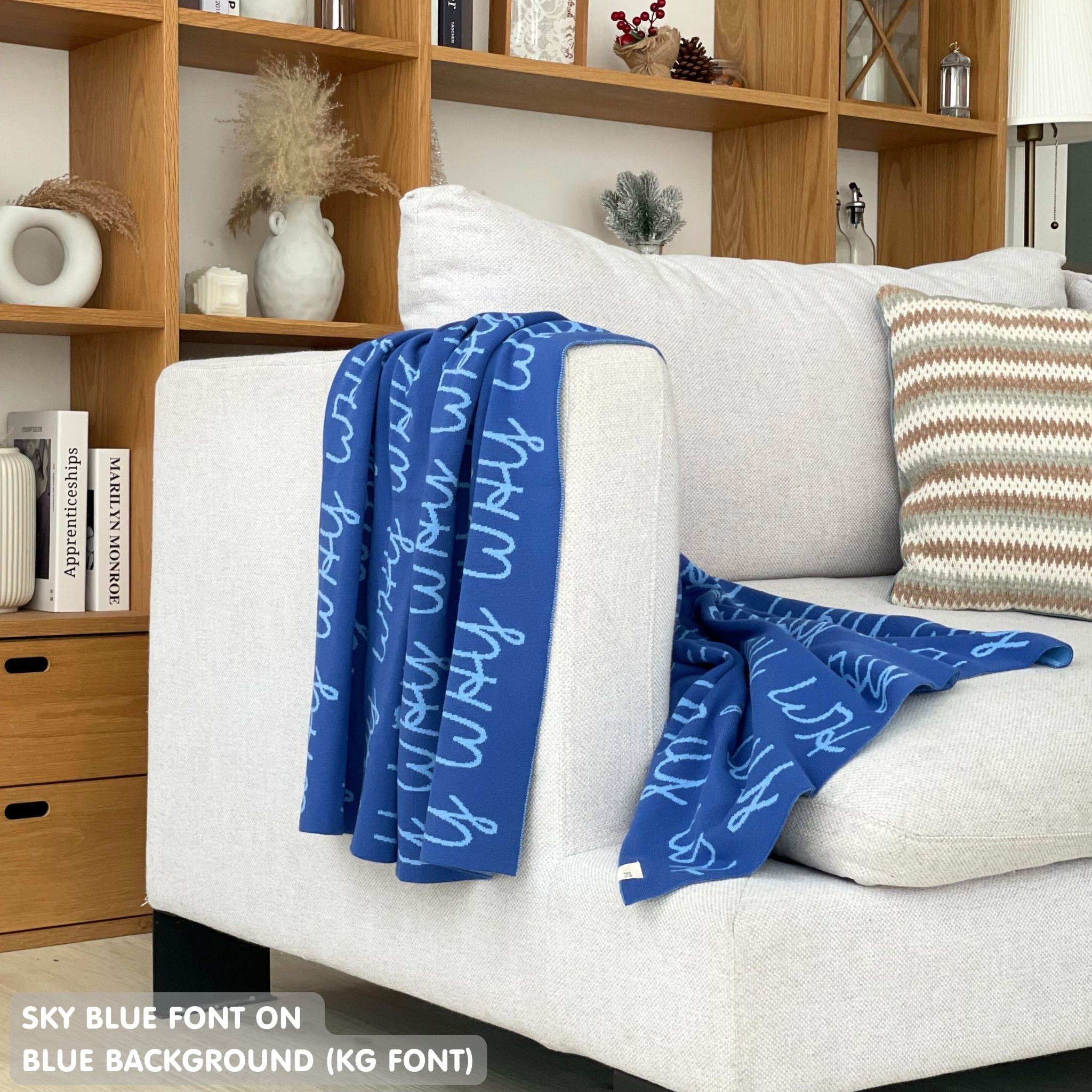 Baby blanket knitted from cotton personalized with baby's name in blue and sky blue, made by TinyBitz.