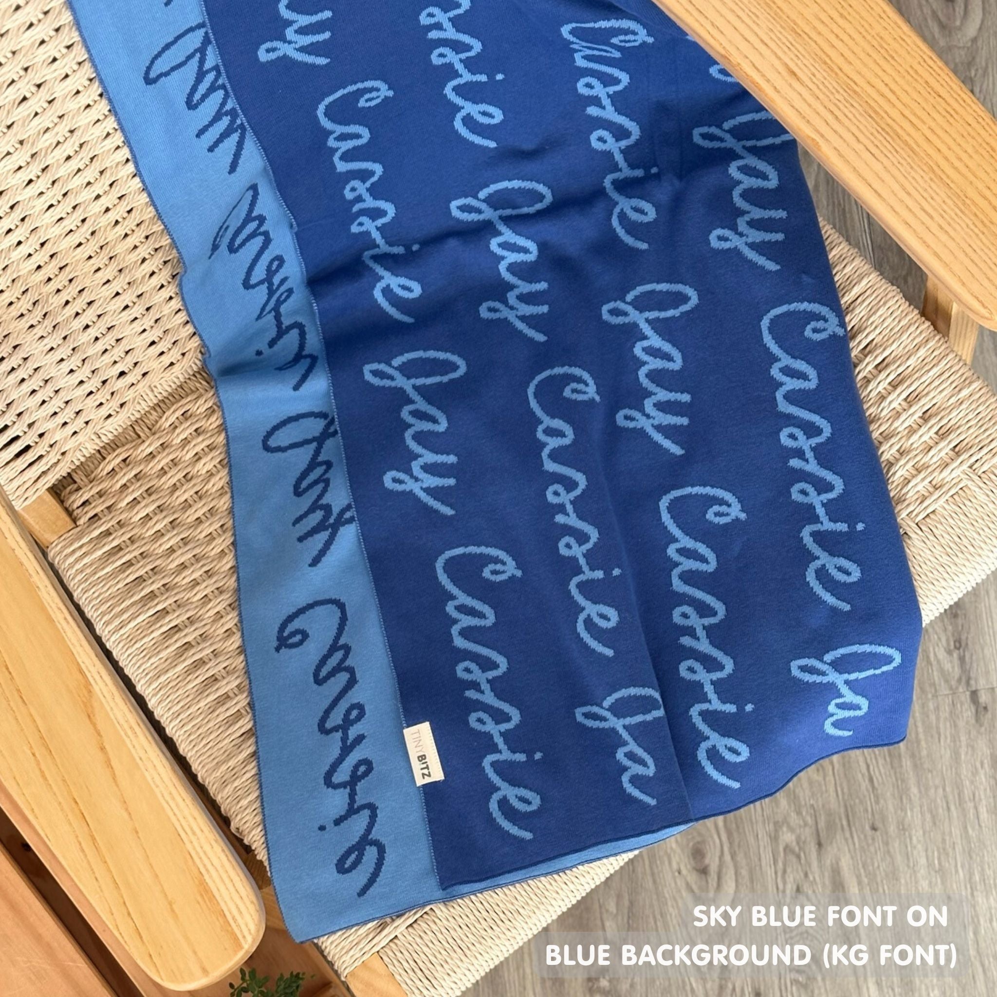 TinyBitz custom name blanket with couple's name knitted in blue and sky blue, making the perfect wedding or anniversary gift!