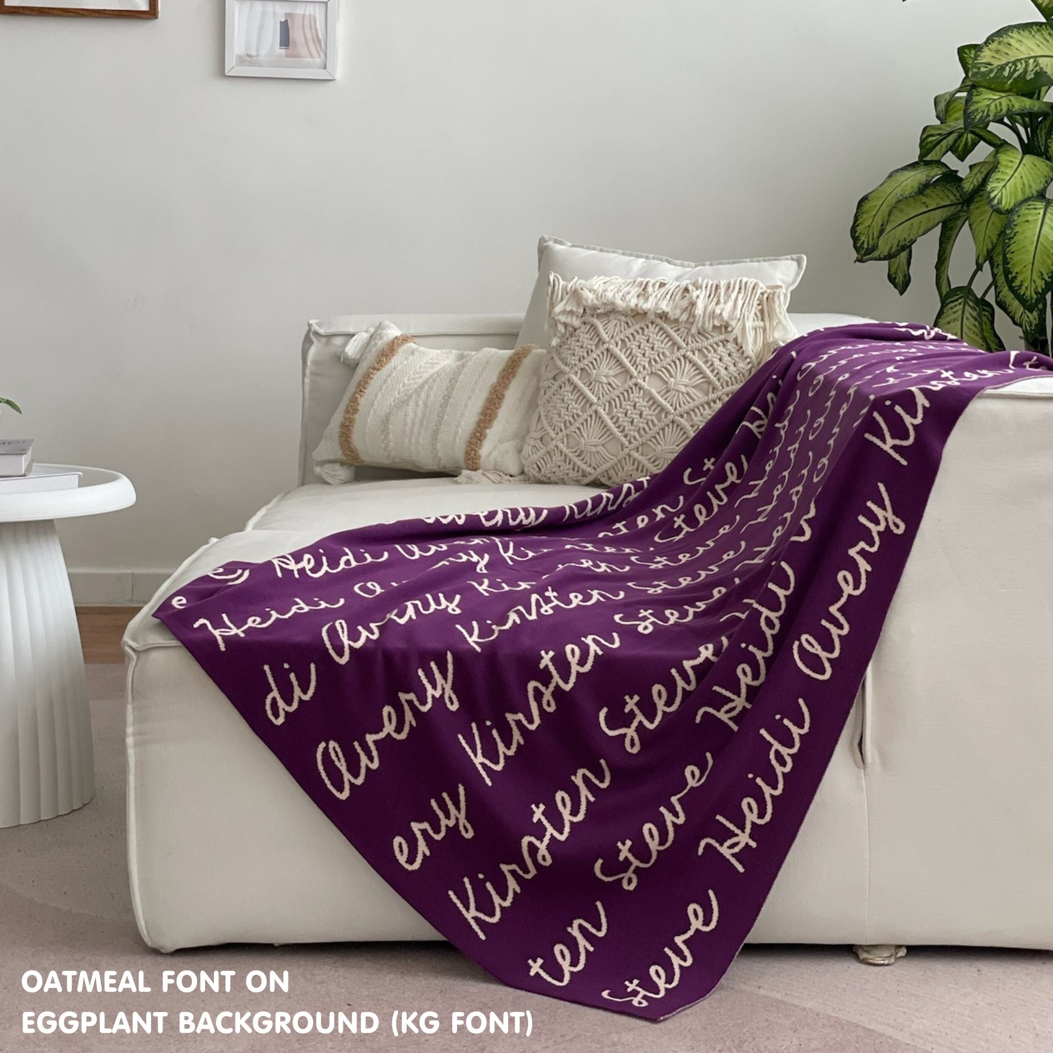 Custom name blanket draped on sofa, knitted in eggplant and oatmeal makes the best personalised home decor.