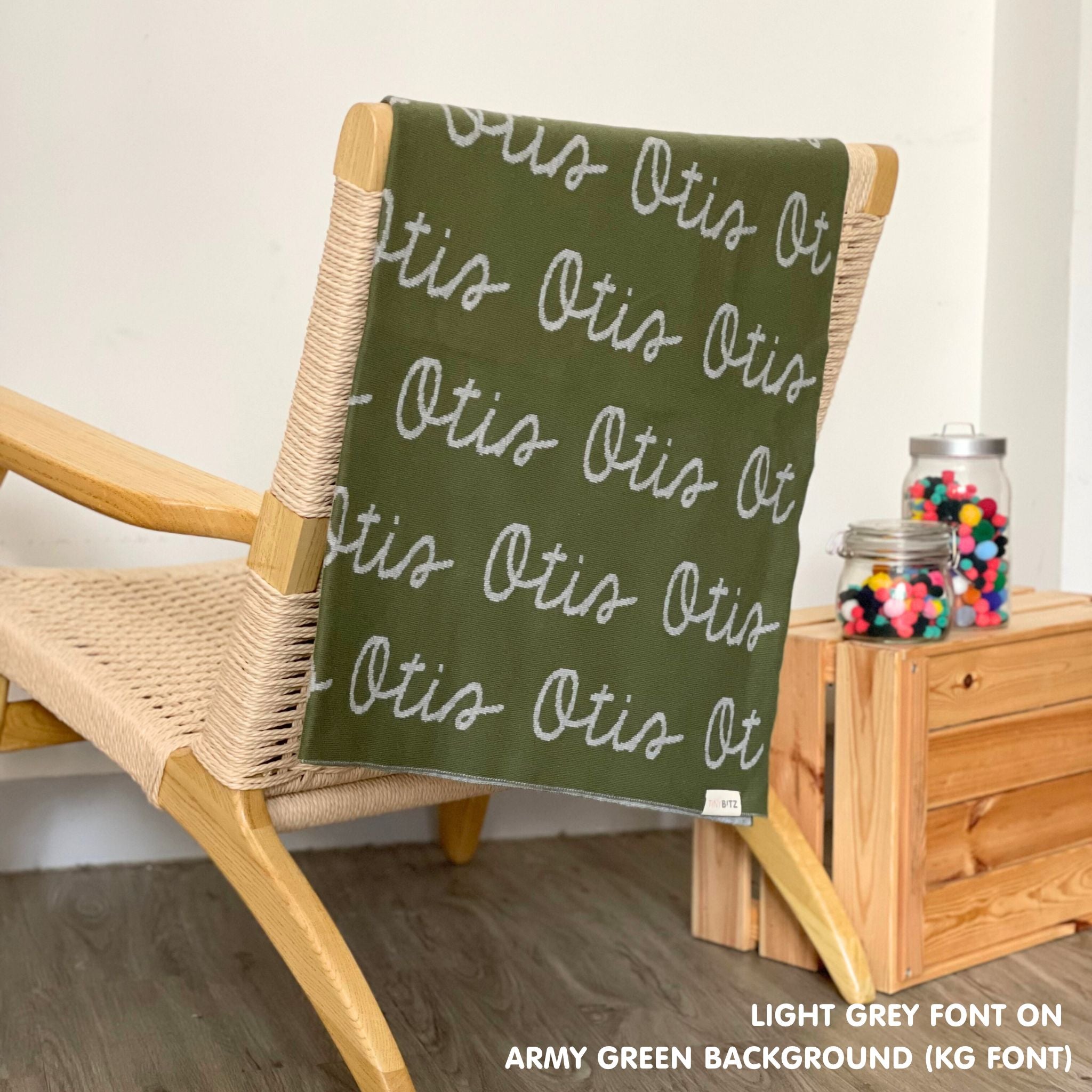 Personalised blanket for adult knitted from cotton in army green and light grey, custom made by TinyBitz.