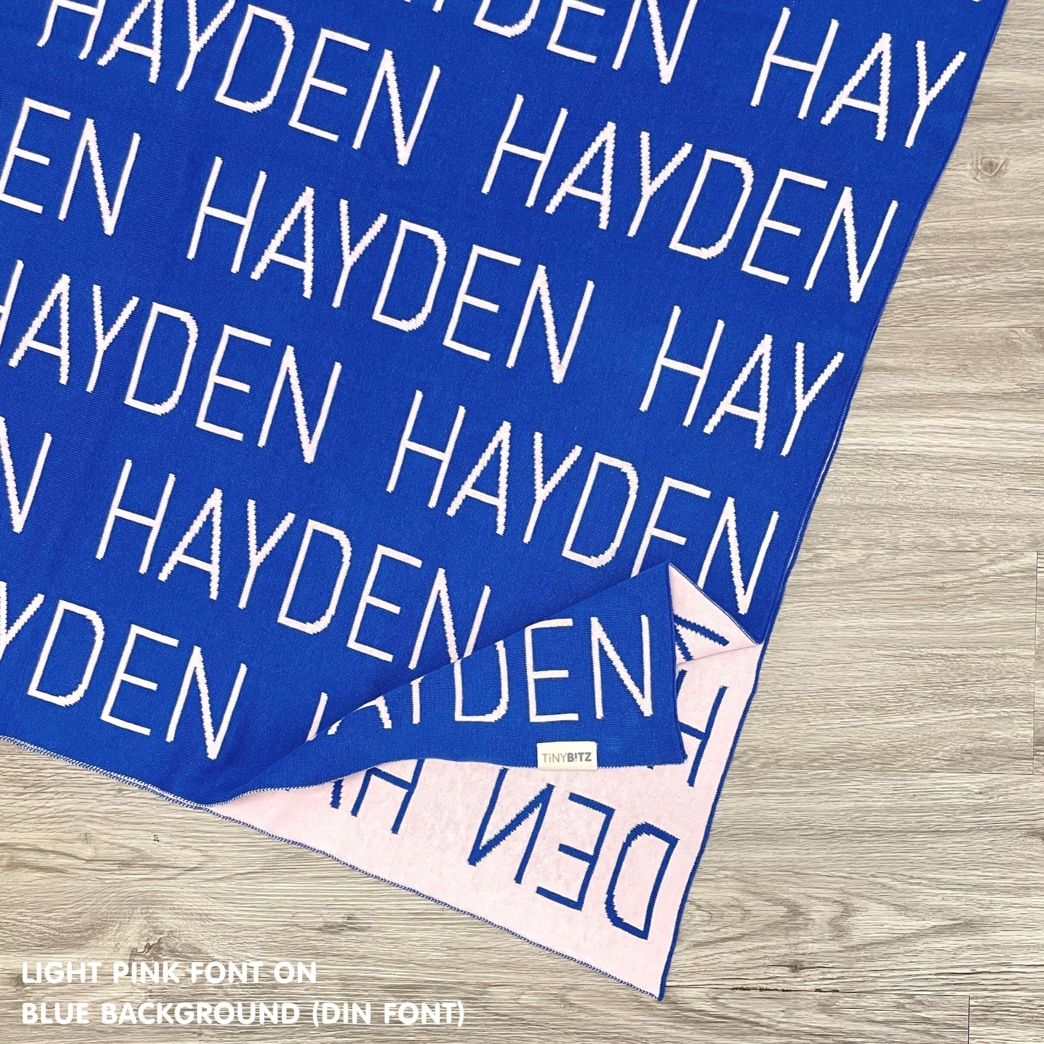 TinyBitz Personalized baby knitted name blanket in blue and light pink, making the best baby shower gift!