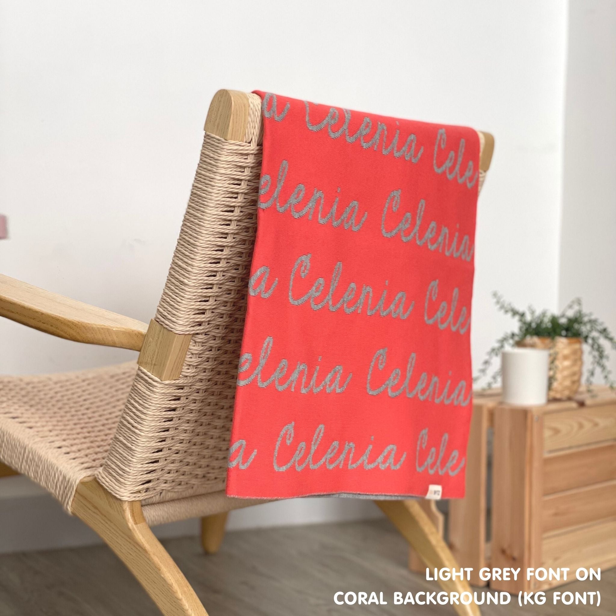 Personalised blanket for adult knitted from cotton in coral and light grey, custom made by TinyBitz.