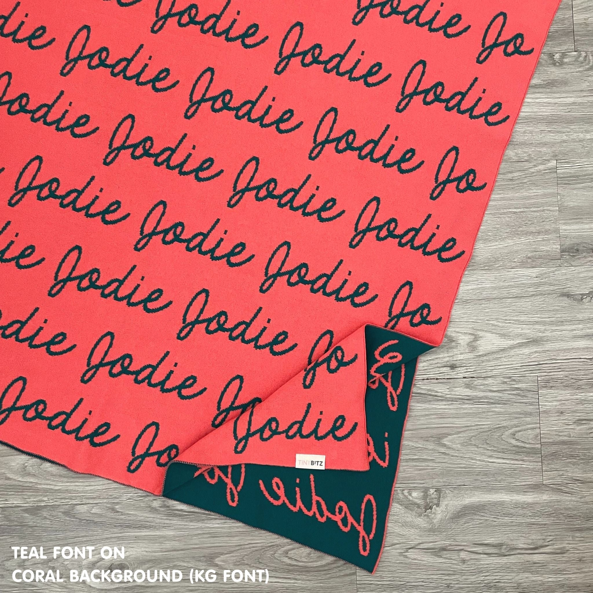 TinyBitz Custom Blanket knitted from cotton with baby's name on coral background, best gift to welcome a newborn baby.