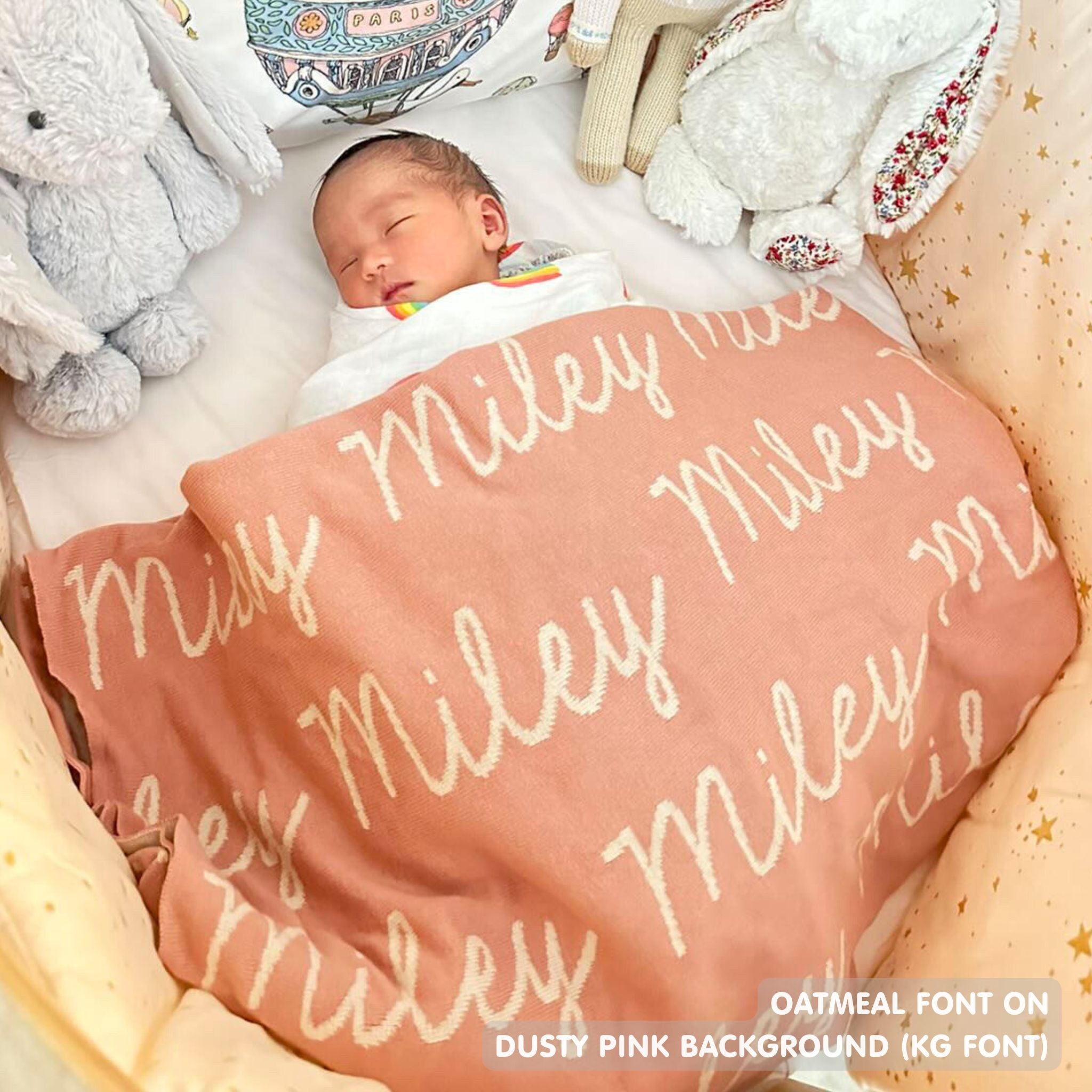 TinyBitz personalized knitted blanket in dusty pink background, customized with baby's name and made from 100% cotton.
