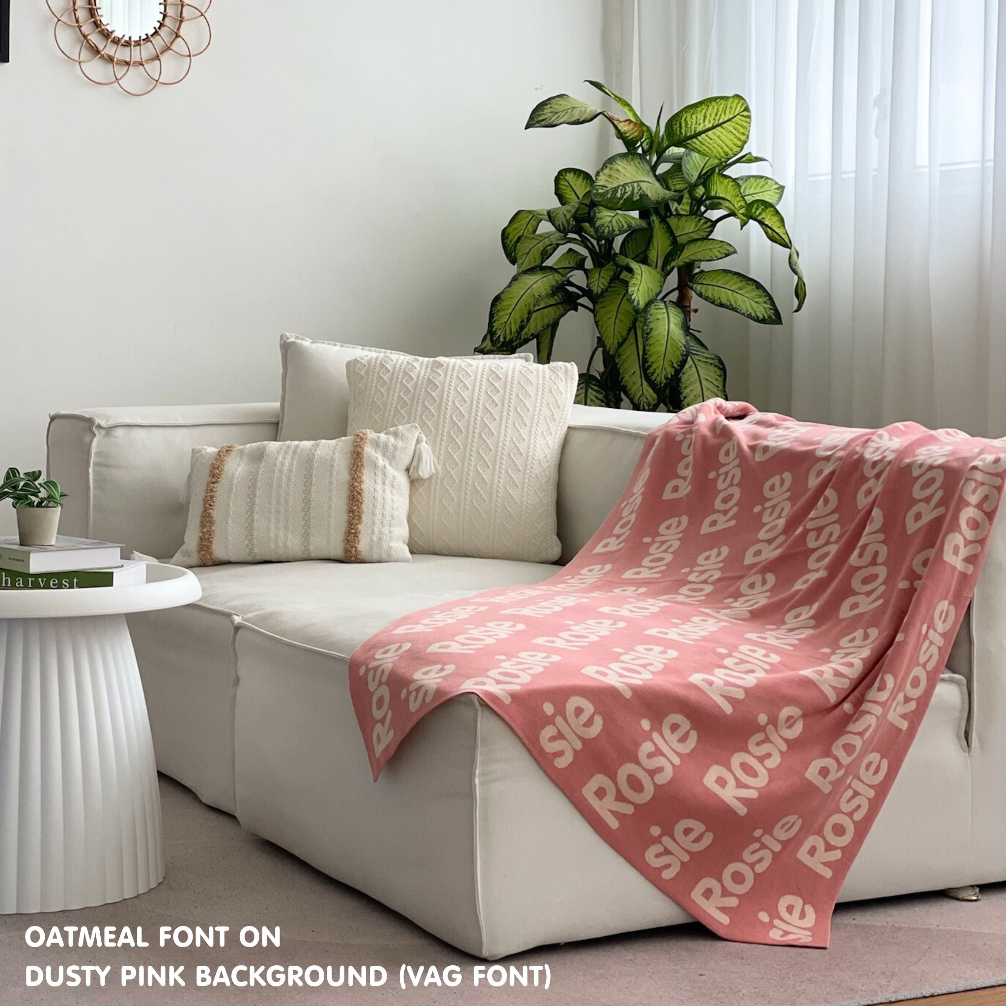 Personalised pet blanket in dusty pink and oatmeal knitted cotton, custom dog blanket by TinyBitz, styled on modern wooden dog bed.