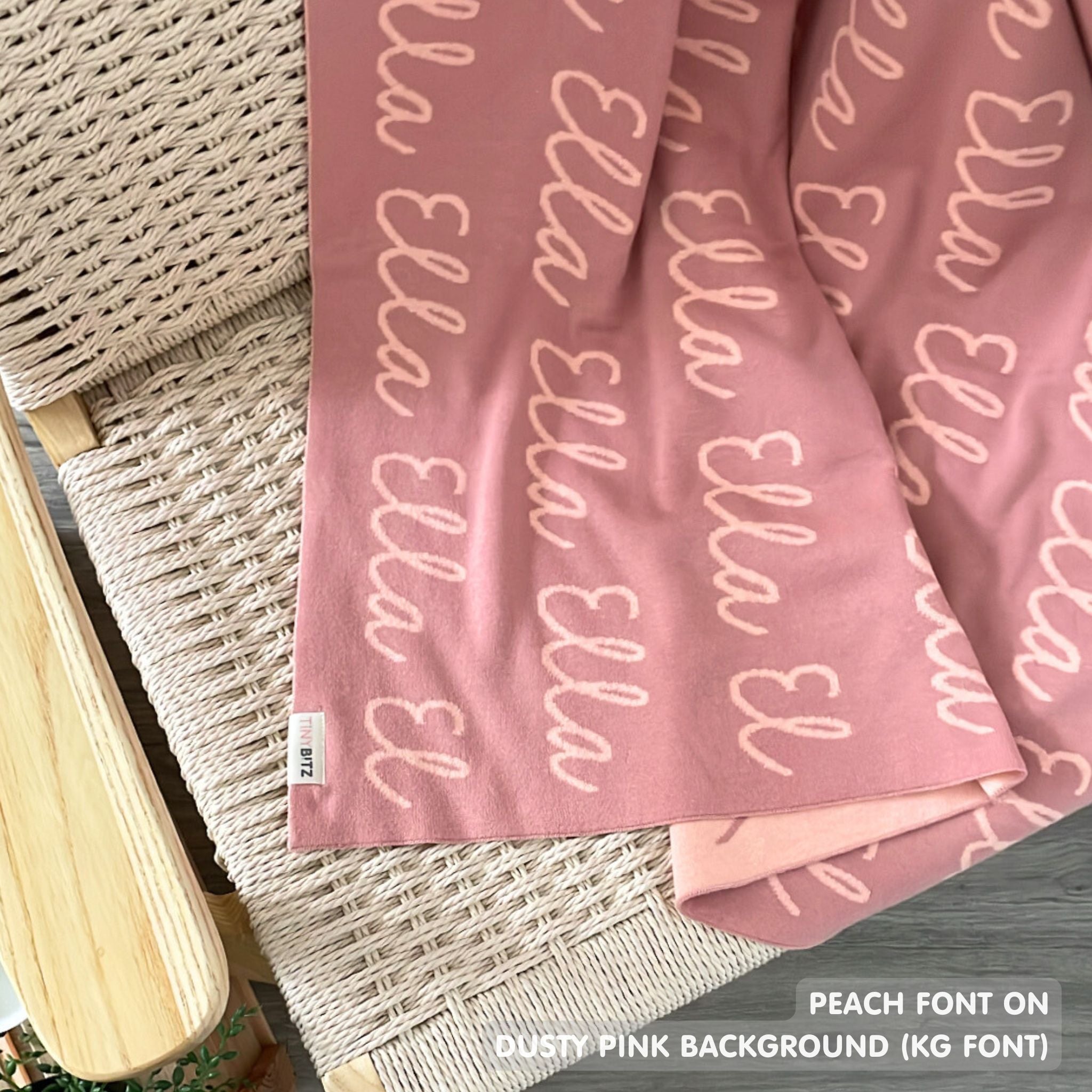 Knitted baby blanket in dusty pink and peach, customised with baby's name, made by TinyBitz.