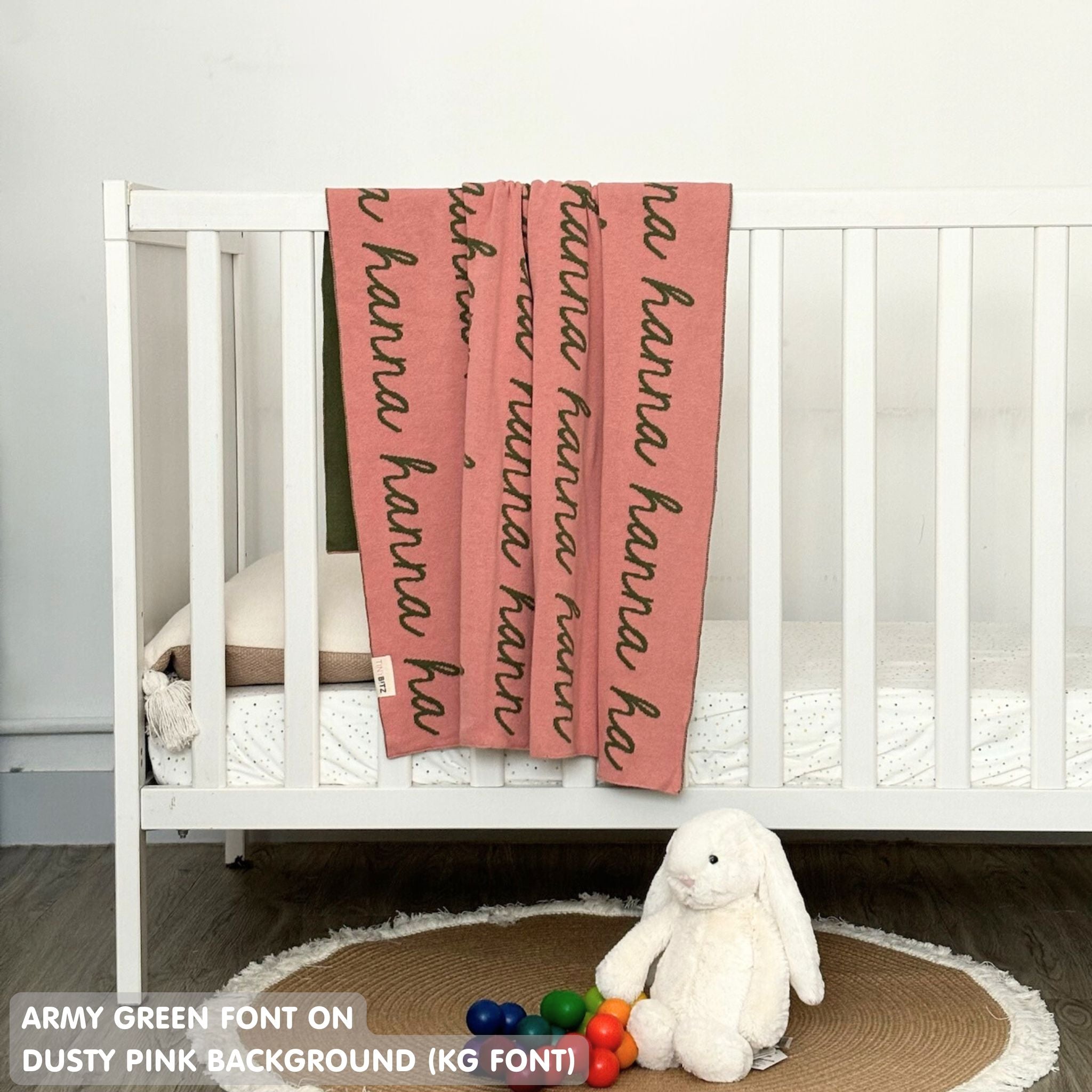 Baby blanket knitted from cotton personalized with baby's name in dusty pink and army green, made by TinyBitz.