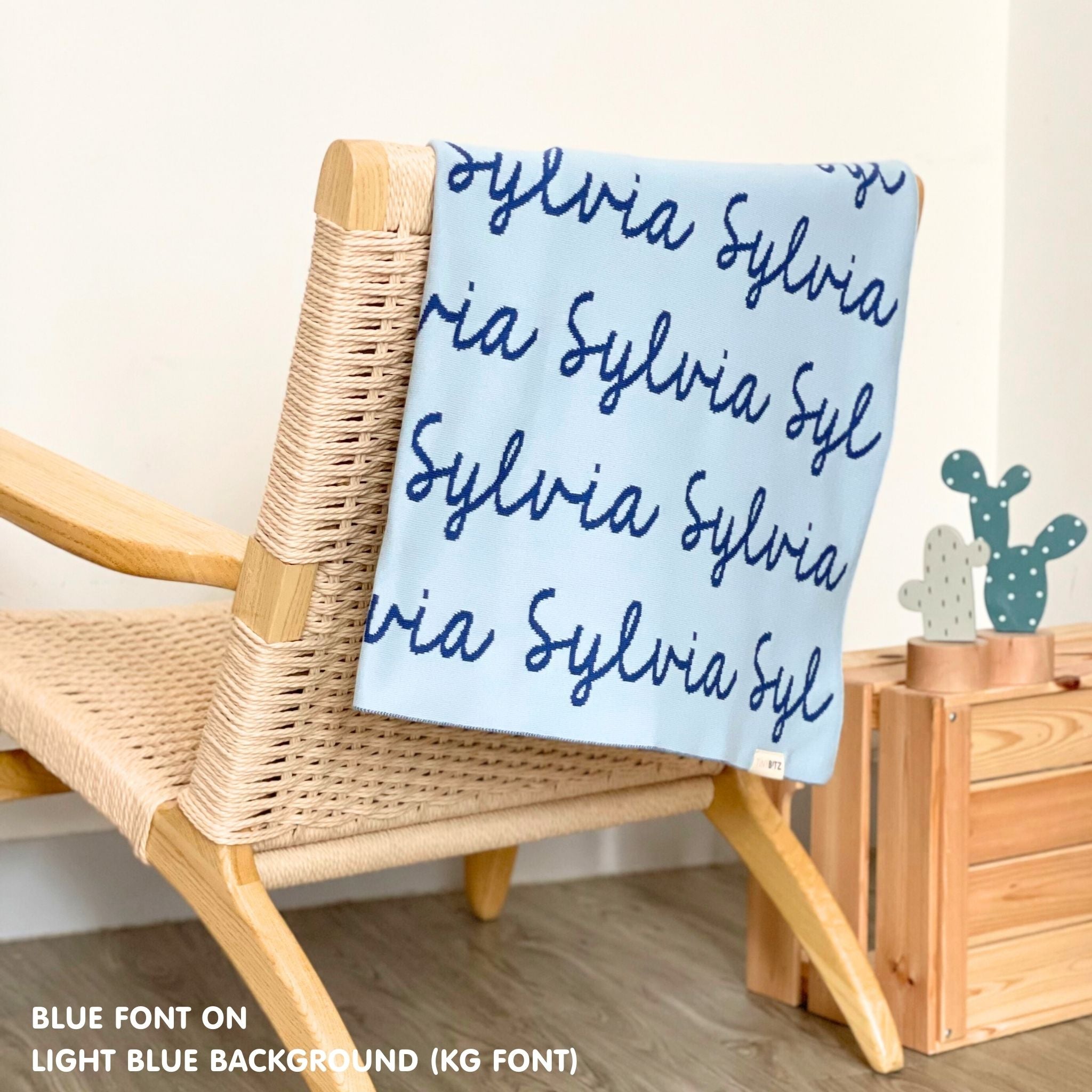 TinyBitz Kids Blanket in light blue and blue, personalized with child's name and made from 100% cotton.