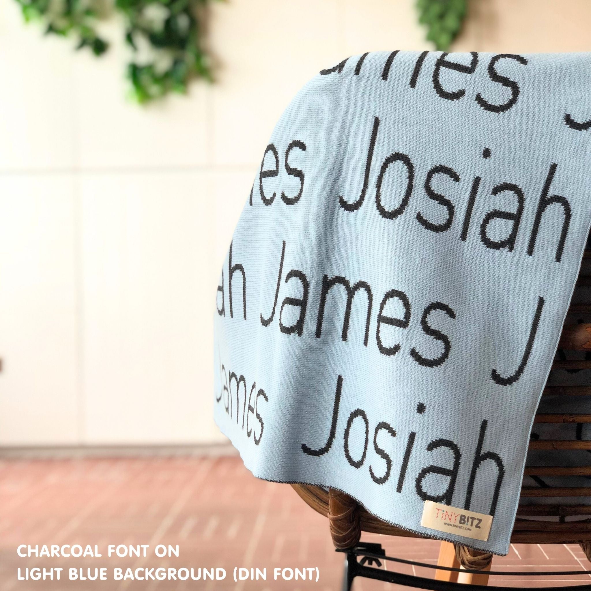 Personalised pet blanket in light blue and charcoal knitted cotton, custom knitted dog blanket by TinyBitz, perfect gift for dog lovers.