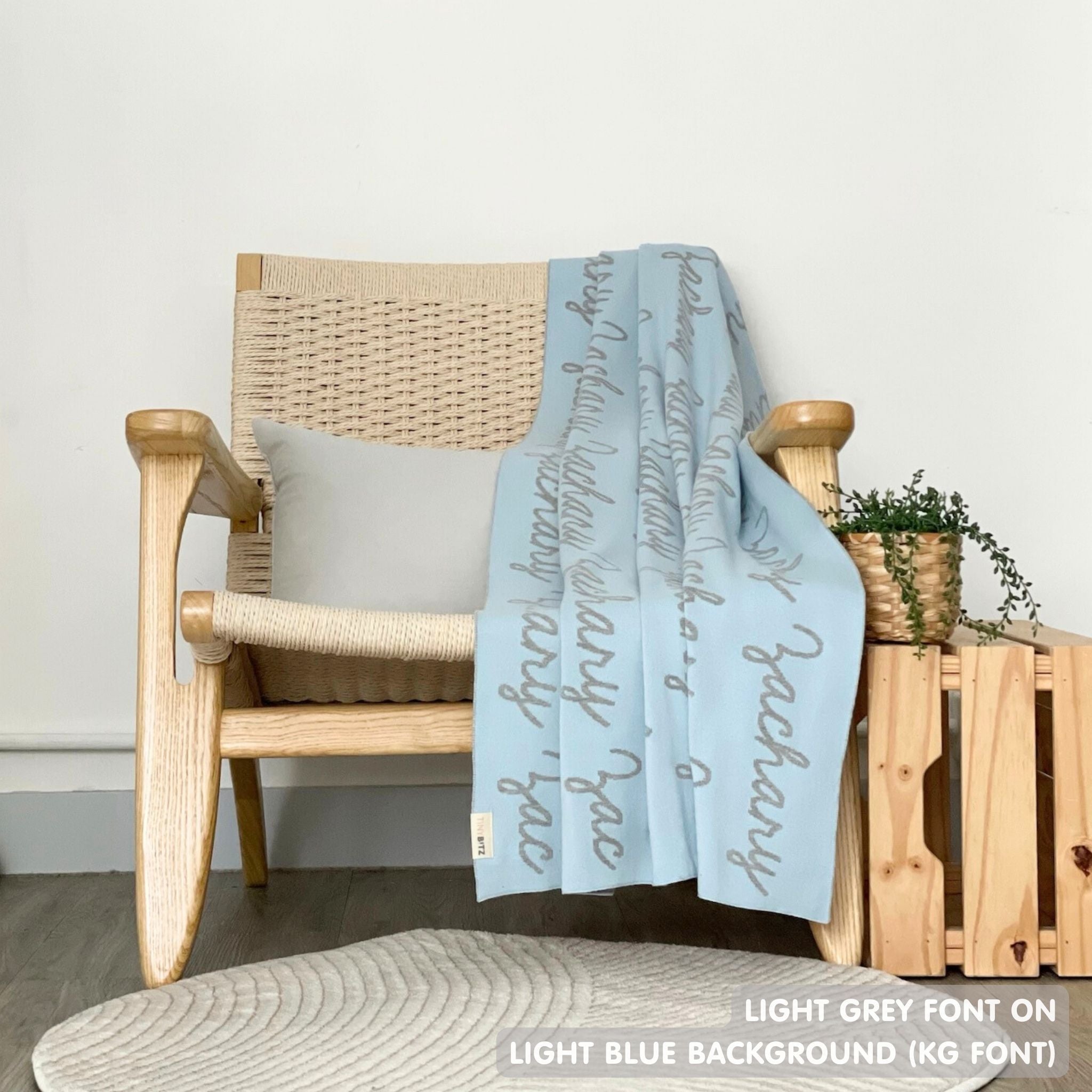 TinyBitz Personalized kids knitted name blanket in light blue and light grey, perfect as a birthday gifts for kids!