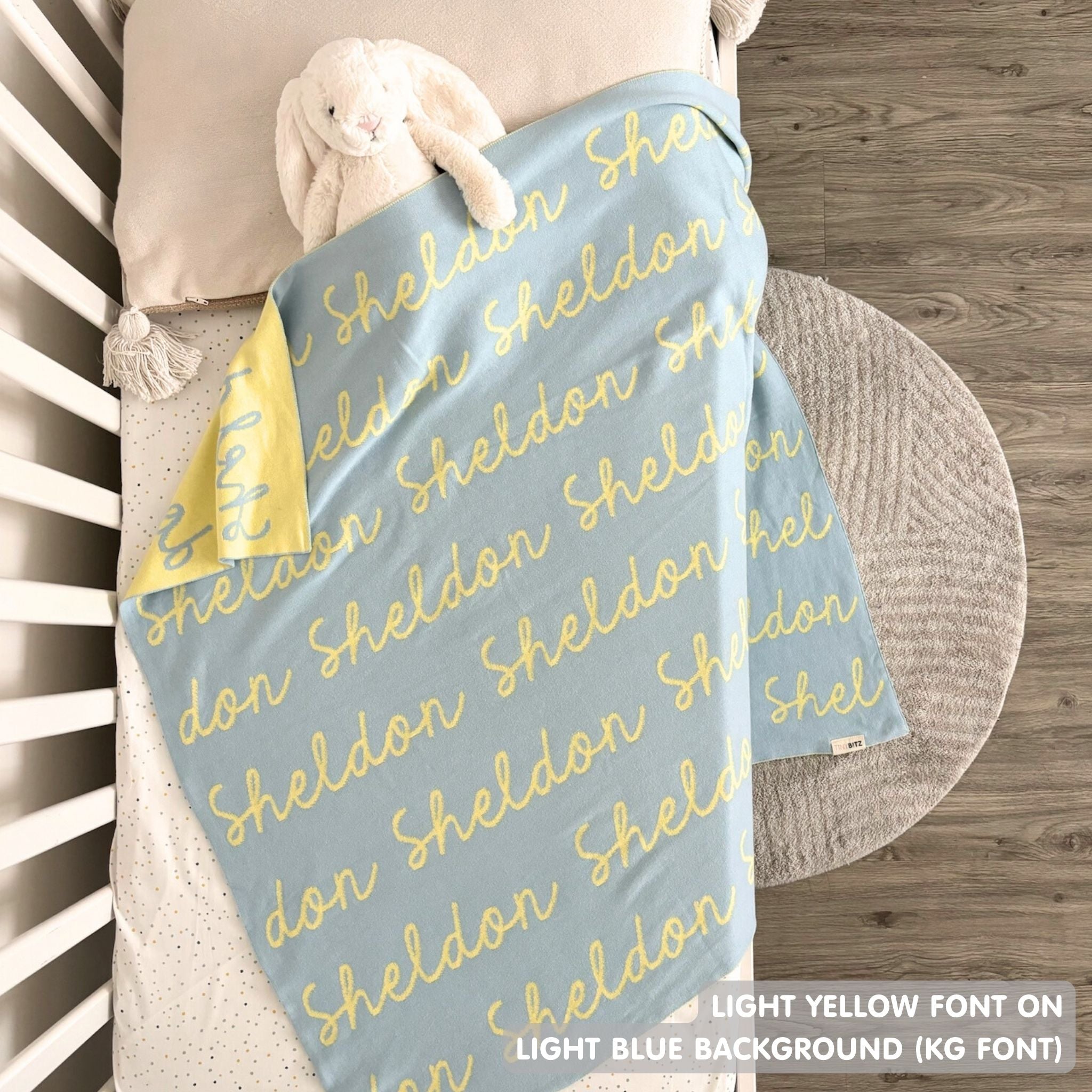 TinyBitz Custom Blanket knitted from cotton with baby's name on light blue background, best gift to welcome a newborn baby.
