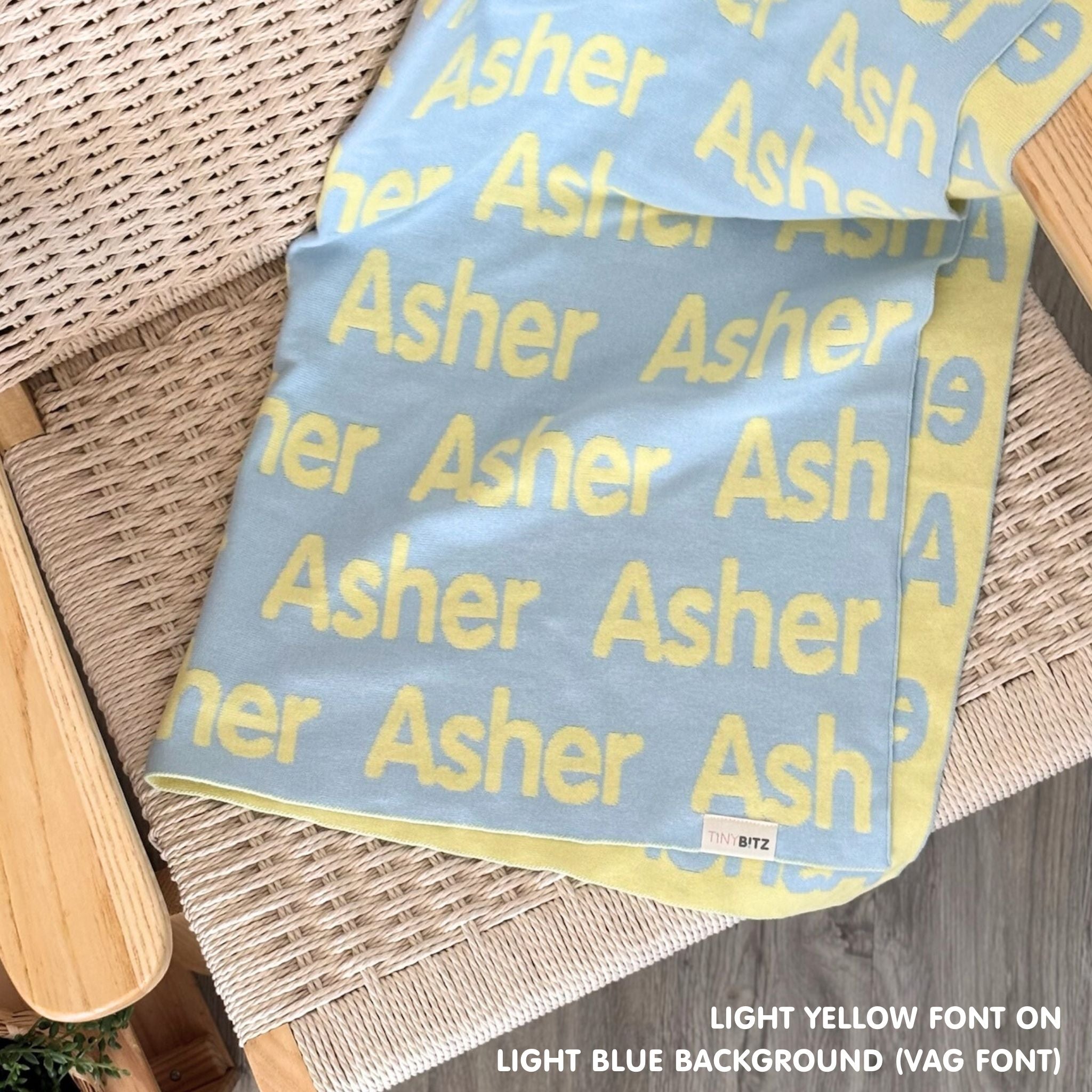 Knitted Children blanket in light blue and light yellow, customised with kid's name, made by TinyBitz.