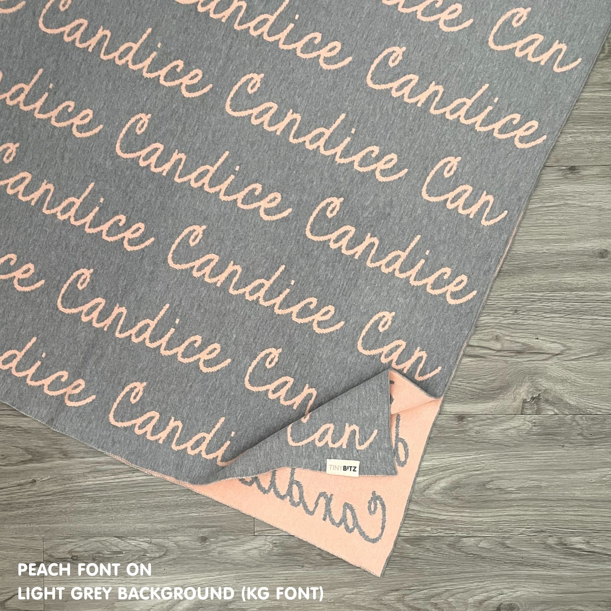 TinyBitz Personalized baby knitted name blanket in light grey and peach, making the best baby shower gift!