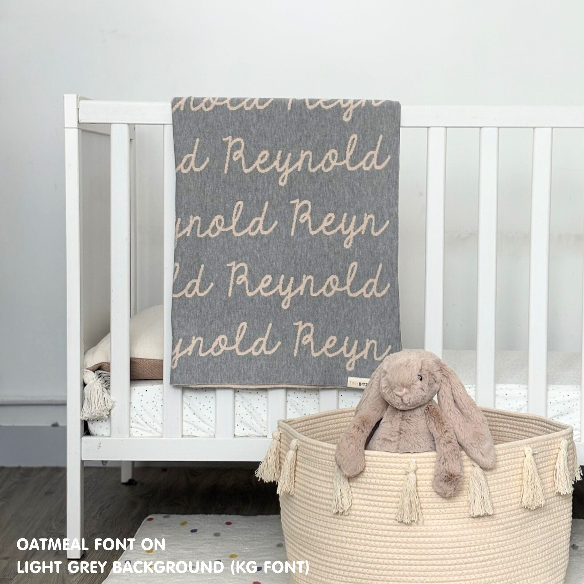 Baby blanket knitted from cotton personalized with baby's name in light grey and oatmeal, made by TinyBitz.