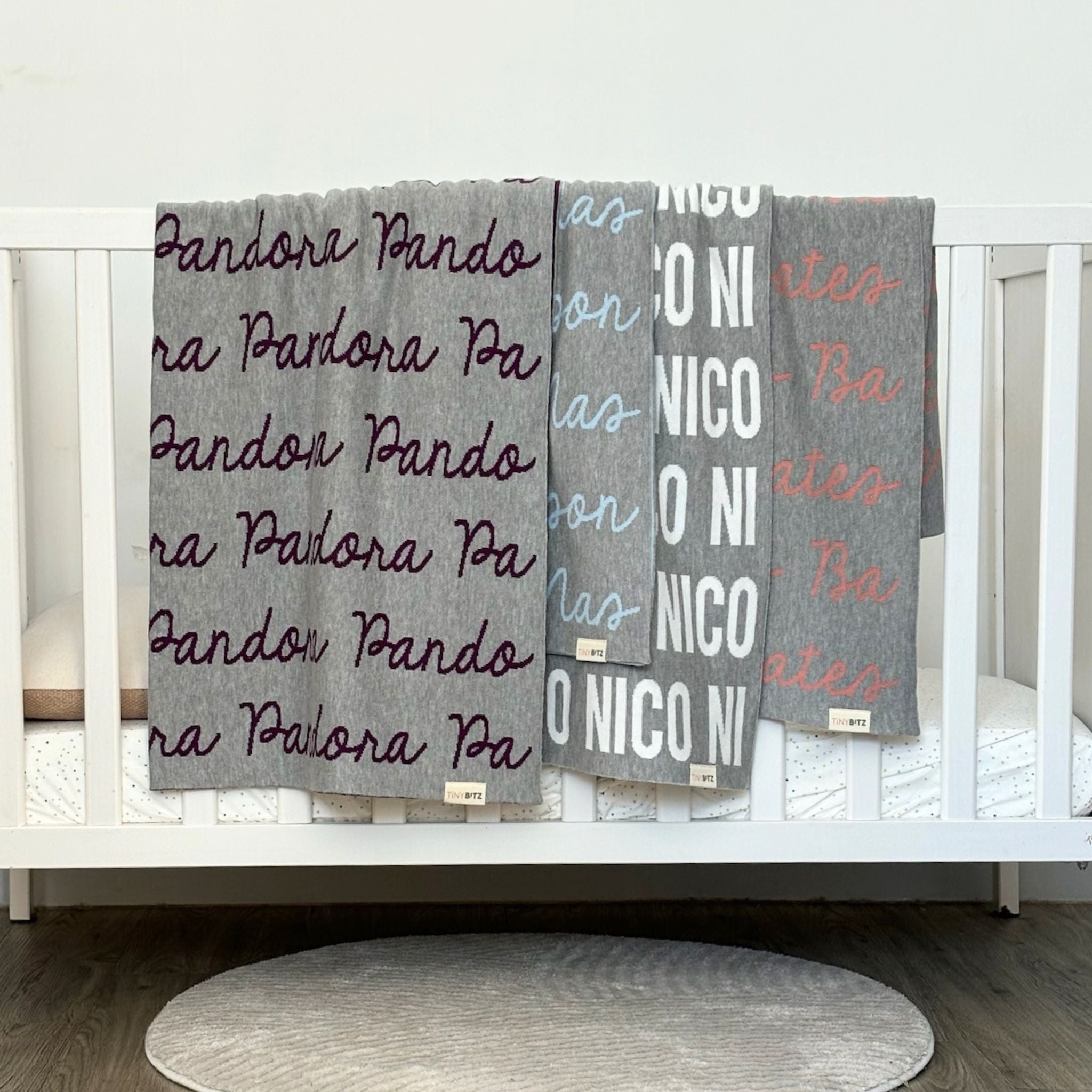 TinyBitz Personalized name blanket in light grey background, perfect gift for newborn babies.