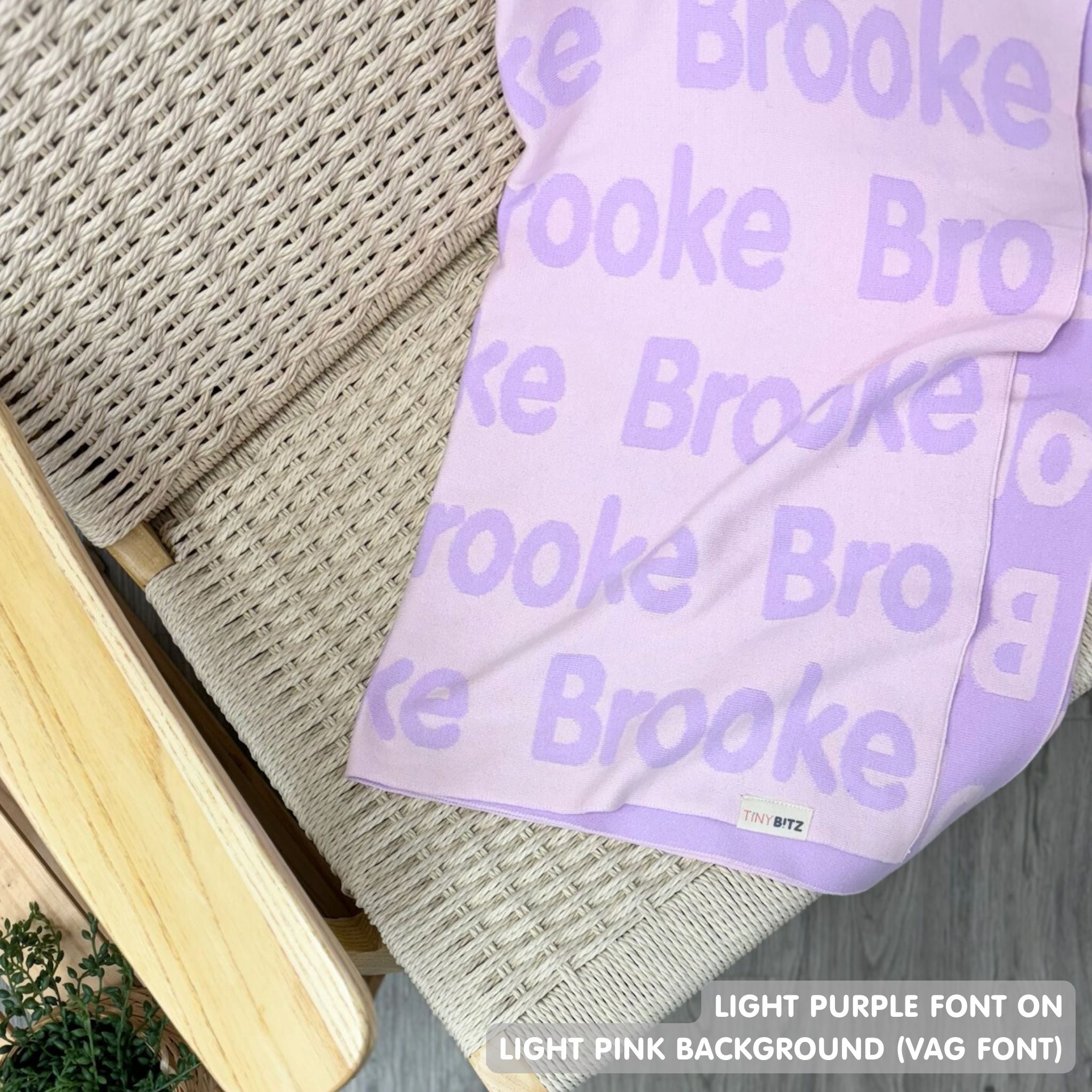 Knitted baby blanket in light pink and light purple, customised with baby's name, made by TinyBitz.