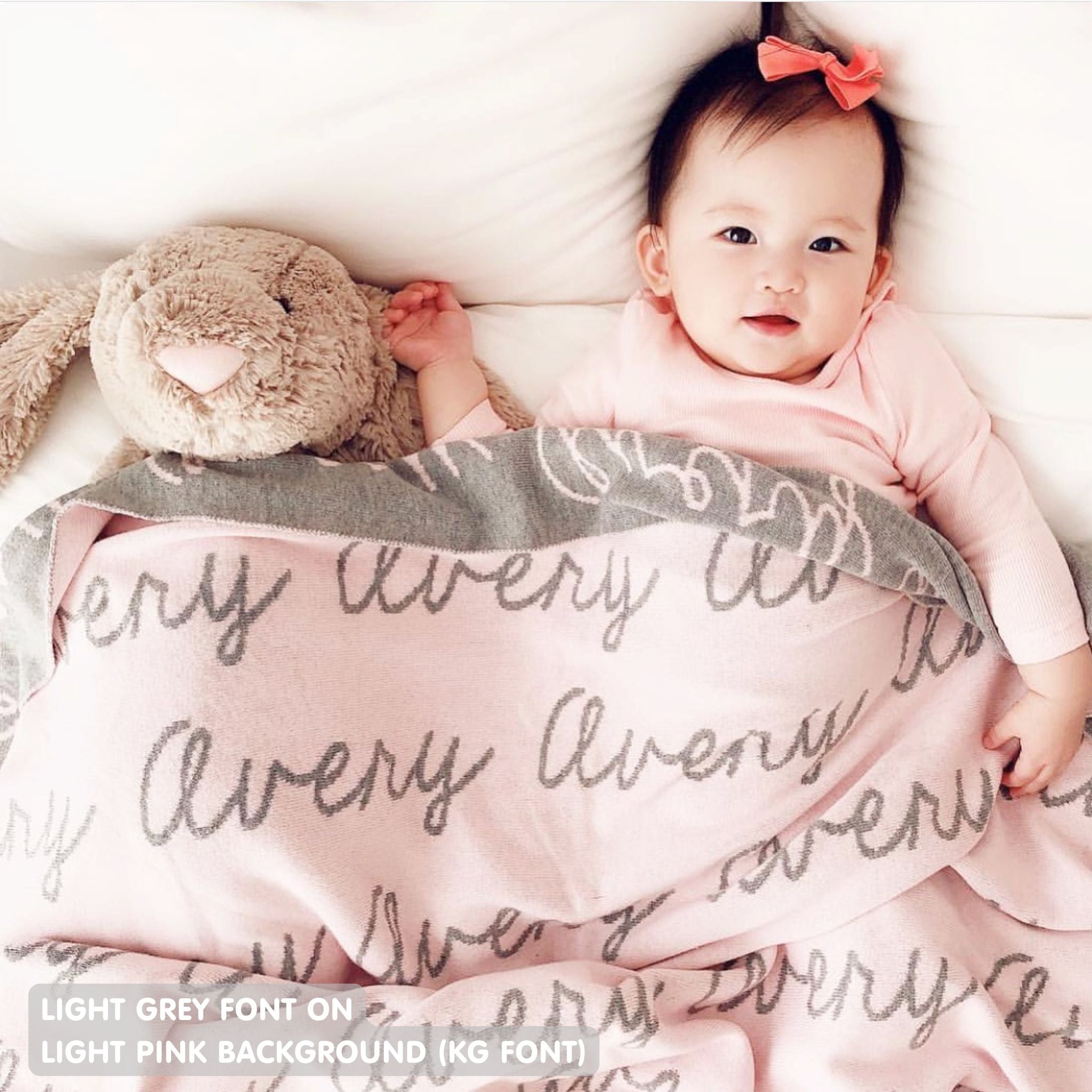 TinyBitz personalized knitted blanket in light pink background, customized with baby's name and made from 100% cotton.
