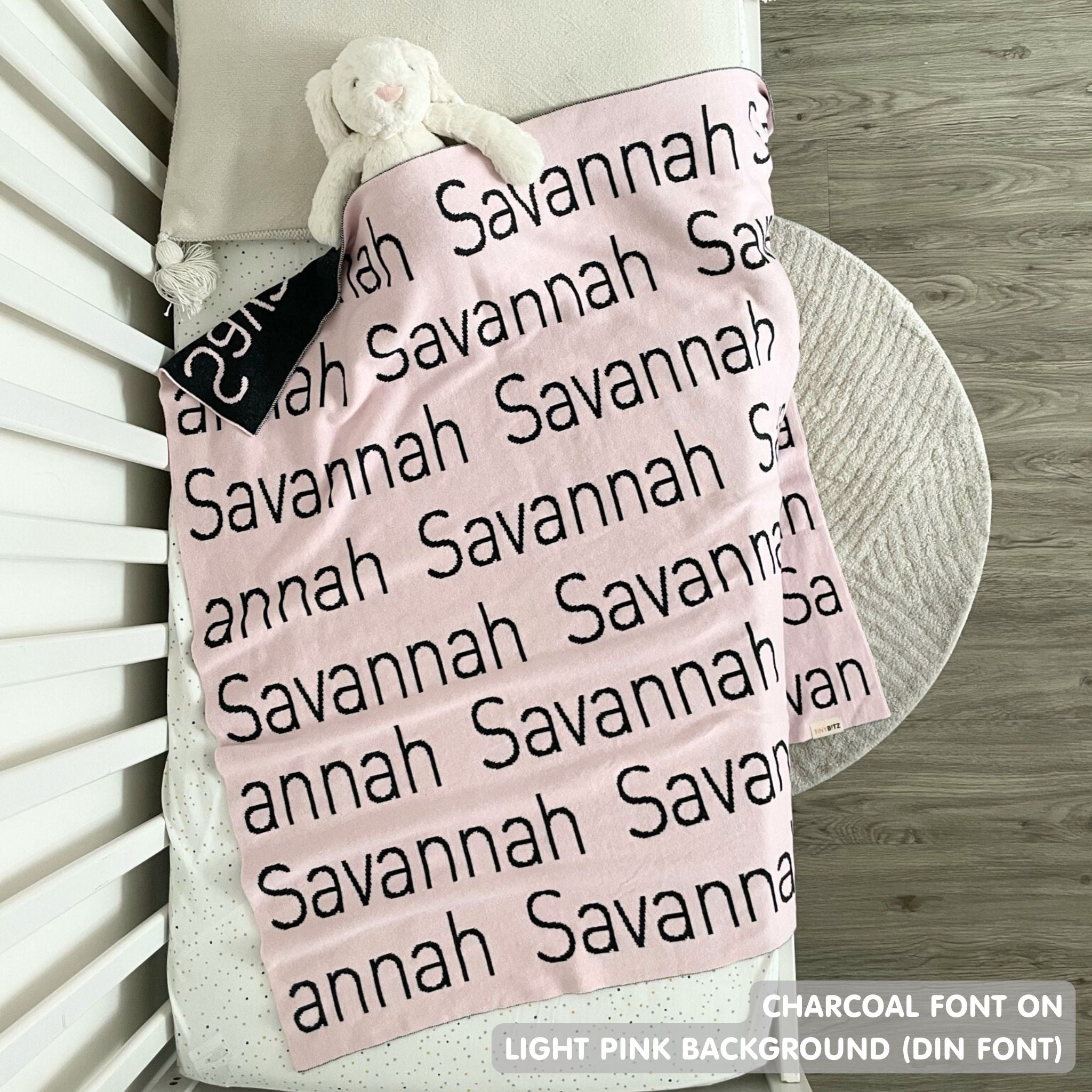 TinyBitz Personalized baby knitted name blanket in light pink and charcoal, making the best baby shower gift!