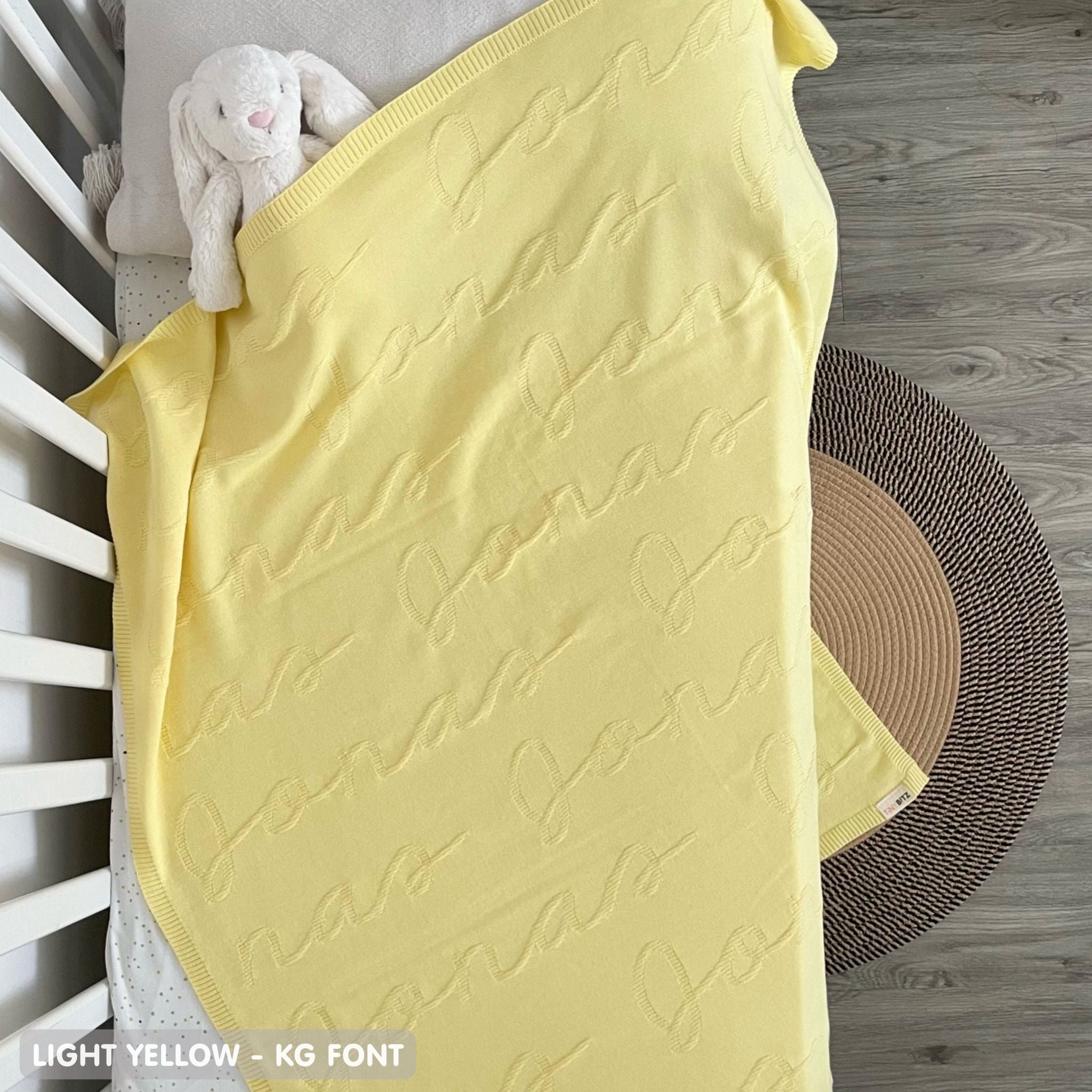 TinyBitz Custom blanket for baby girls knitted from cotton in light yellow background, one colour with monogram, made by TinyBitz.