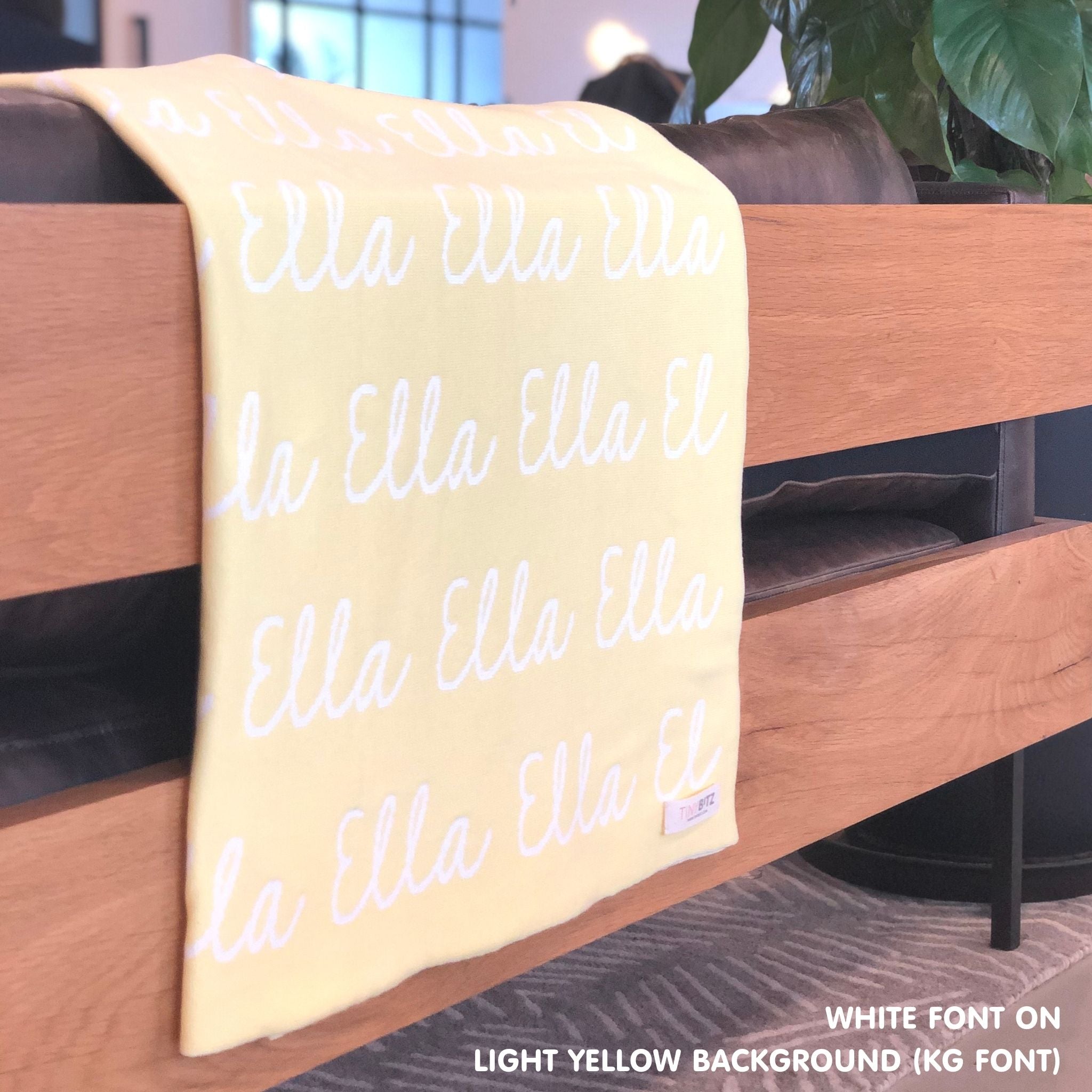 TinyBitz Personalized name blanket in light yellow and white, perfect gift for newborn babies.