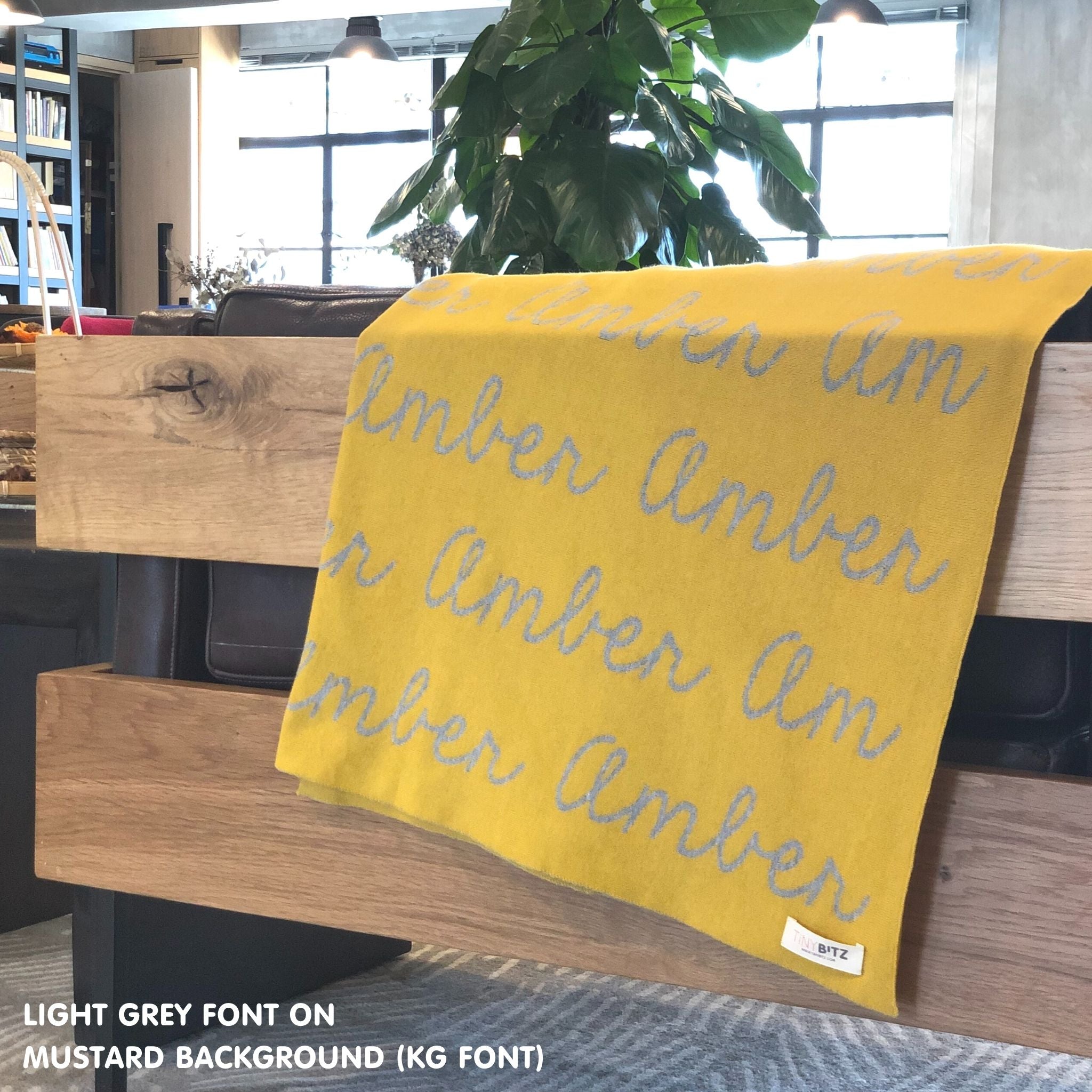 TinyBitz Custom Blanket knitted from cotton with baby's name on mustard background, best gift to welcome a newborn baby.