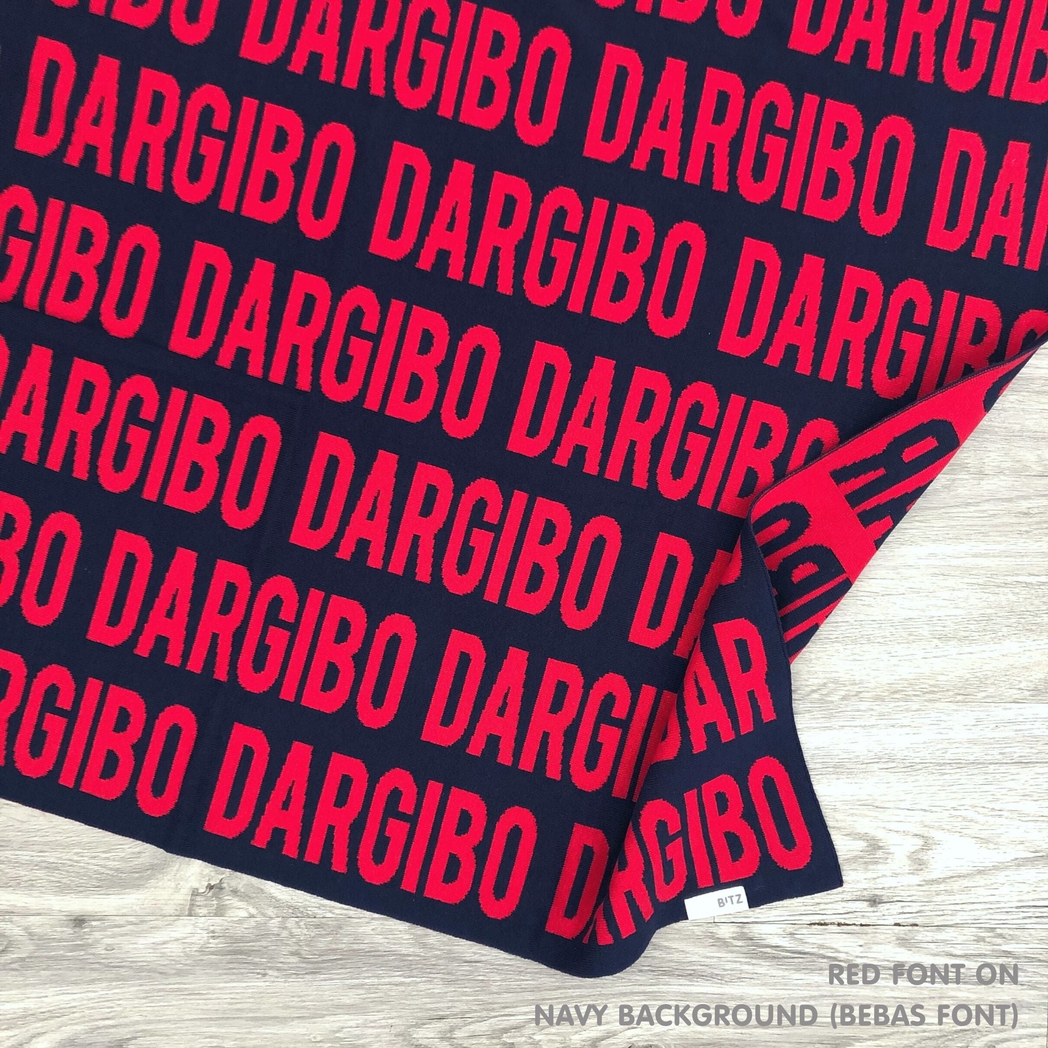 Personalised blanket for adult knitted from cotton in navy and red, custom made by TinyBitz.