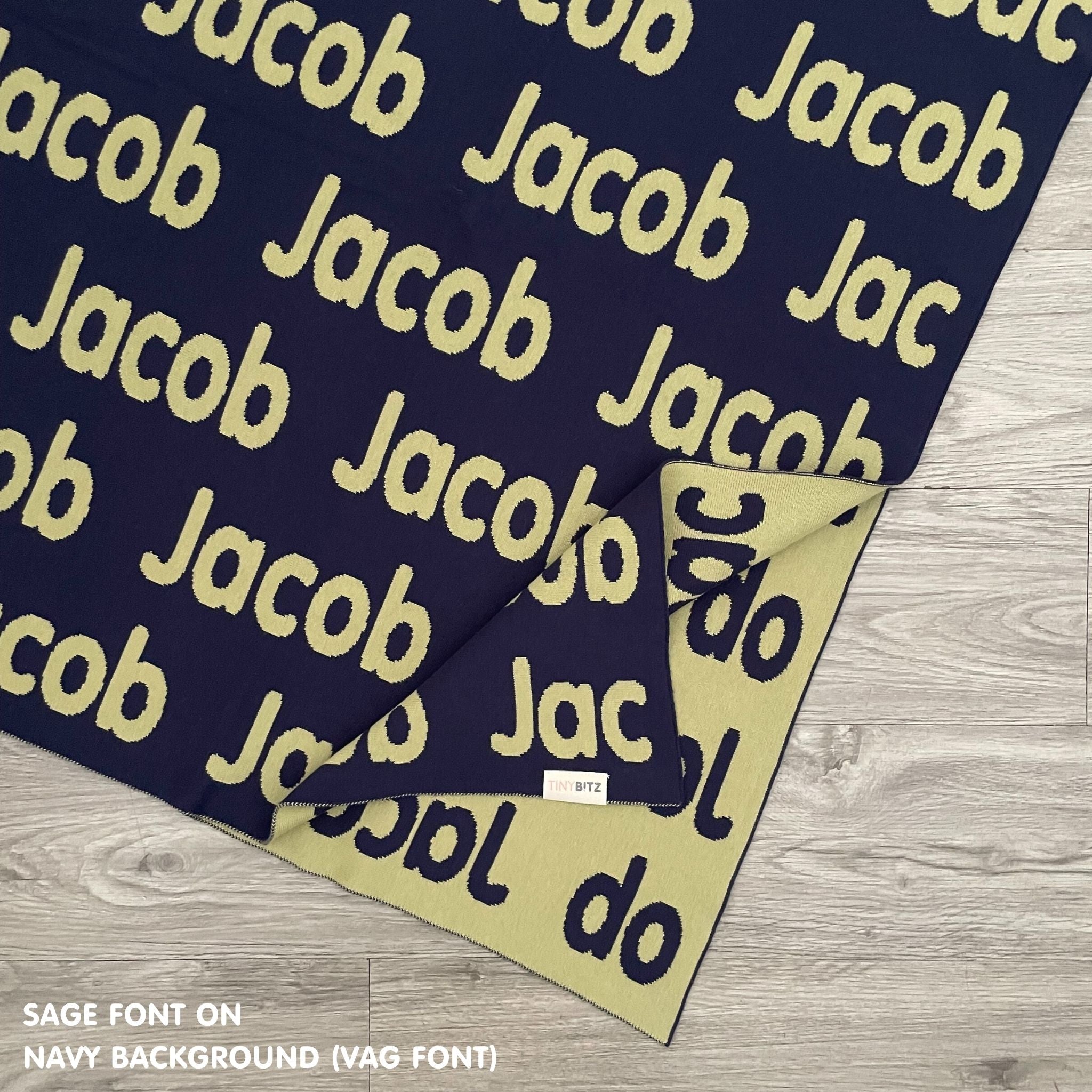TinyBitz Personalized baby knitted name blanket in navy and sage, making the best baby shower gift!