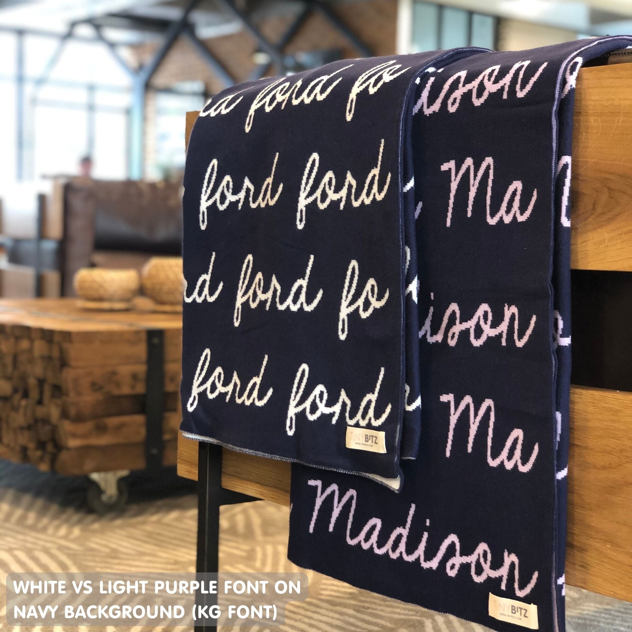 Customisable blanket with adult's name knitted in navy colour, personalized by TinyBitz.