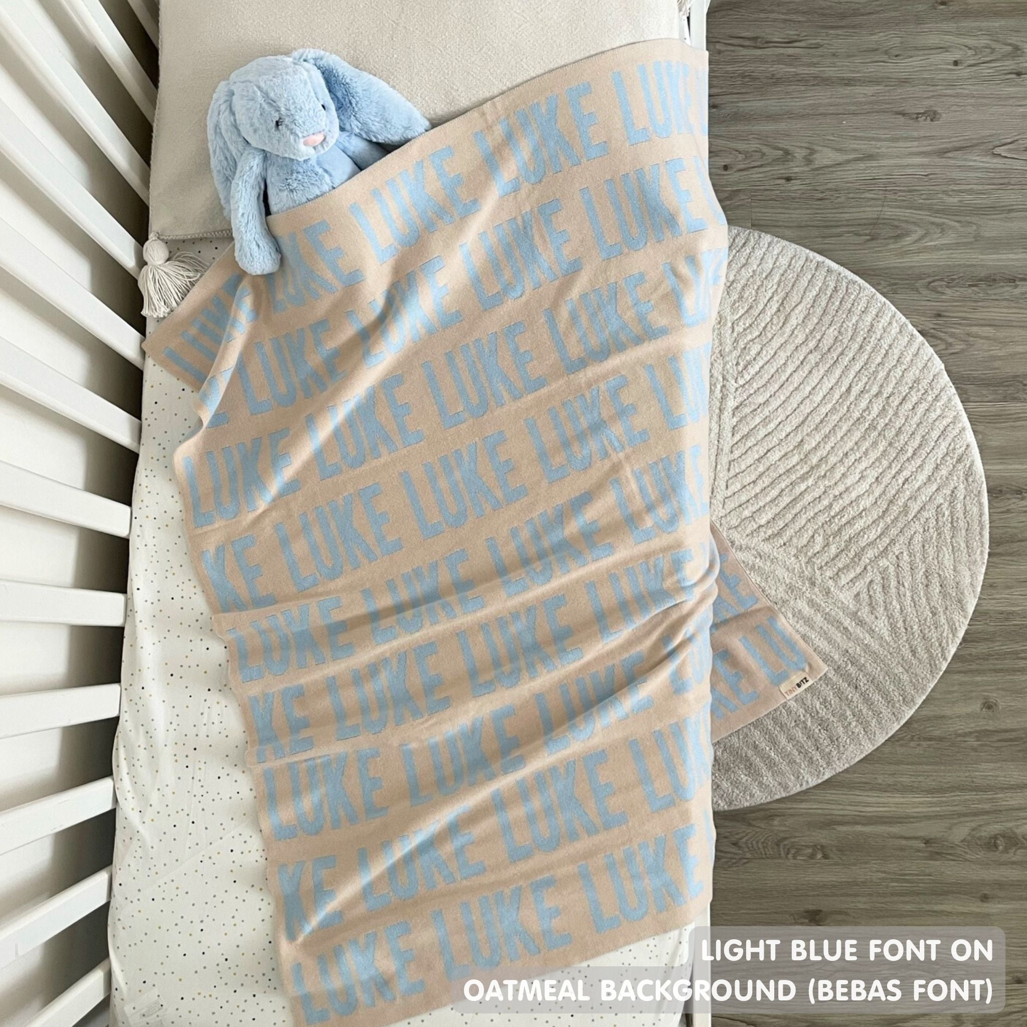 TinyBitz knitted name blanket in oatmeal and light blue can be used to decorate your baby's room!