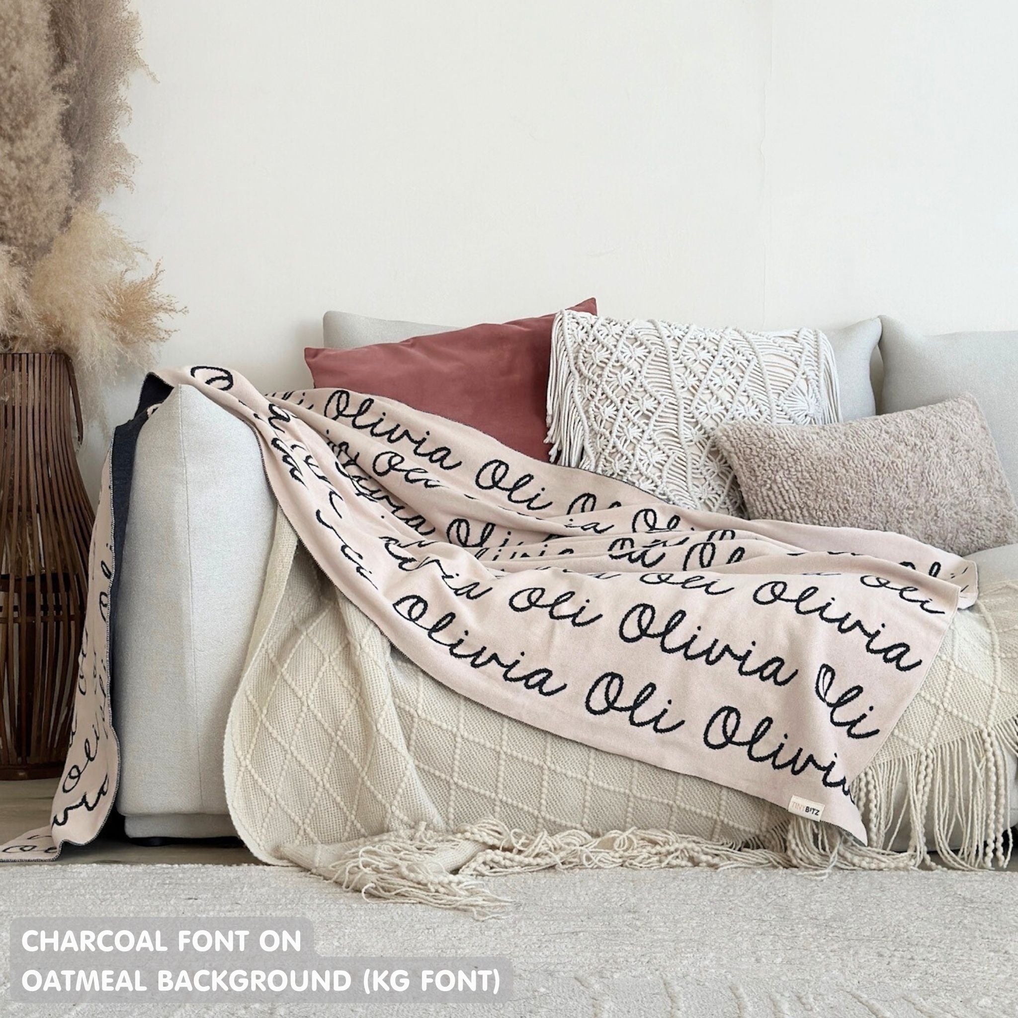 Custom name blanket in oatmeal and blue draped over a chair makes the best personalized home decor.