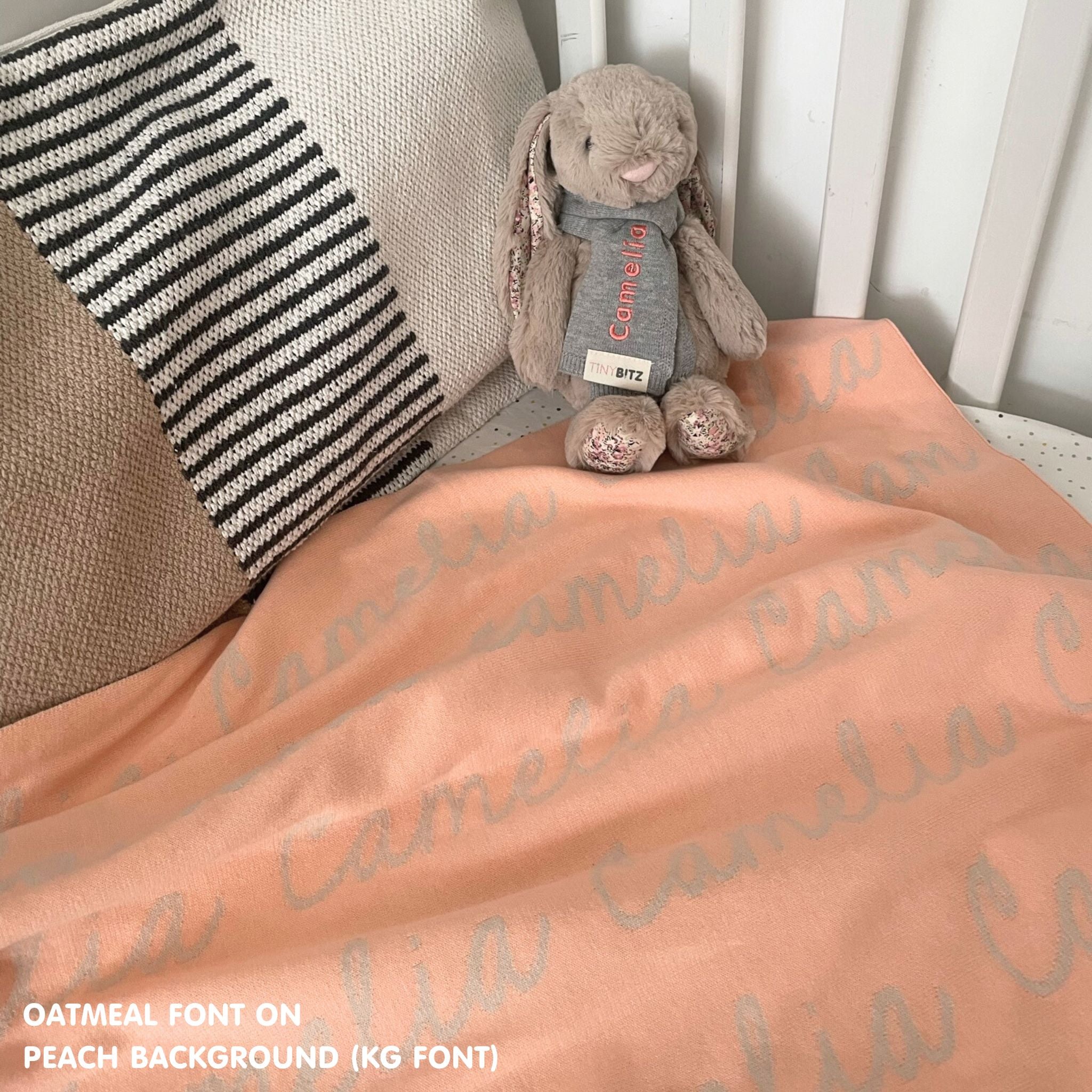 TinyBitz Personalized blanket for baby girls knitted from cotton in peach and oatmeal.