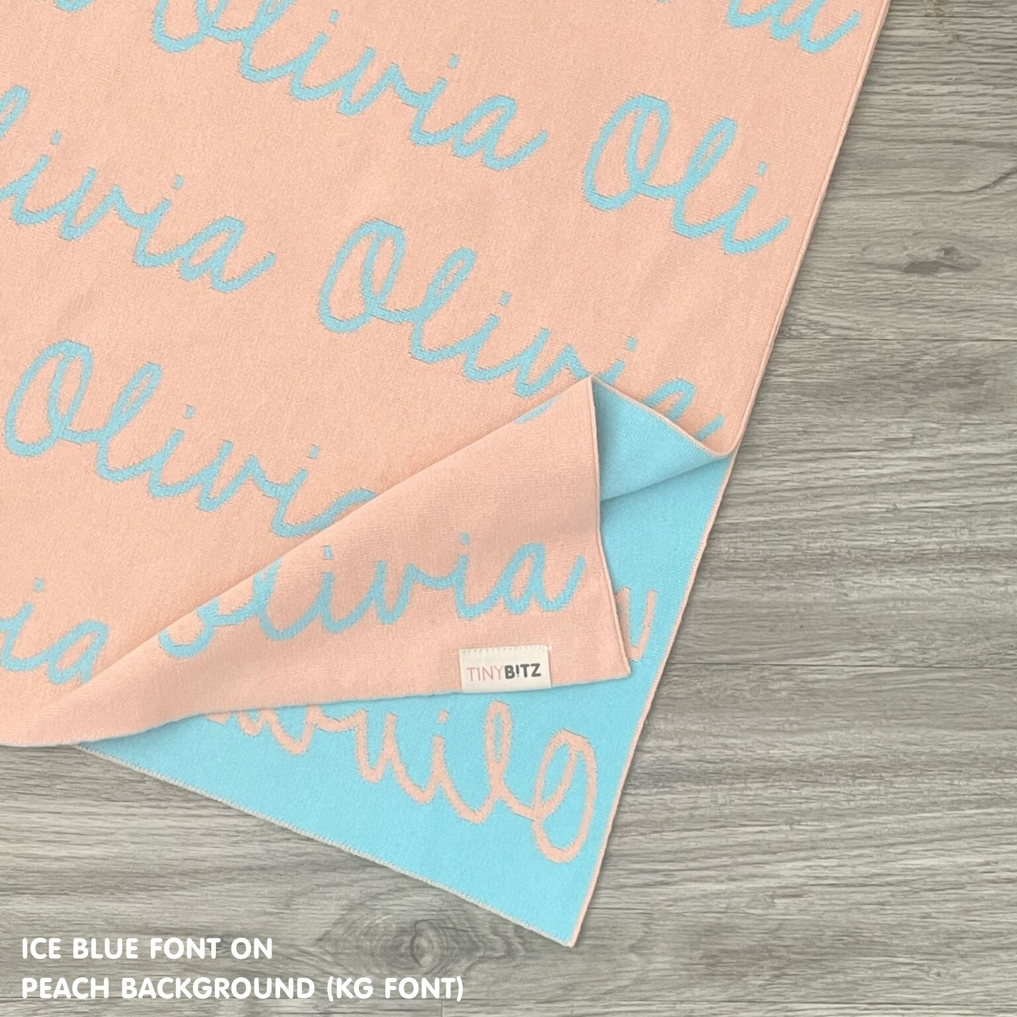 TinyBitz Personalized baby knitted name blanket in peach and ice blue, making the best baby shower gift!